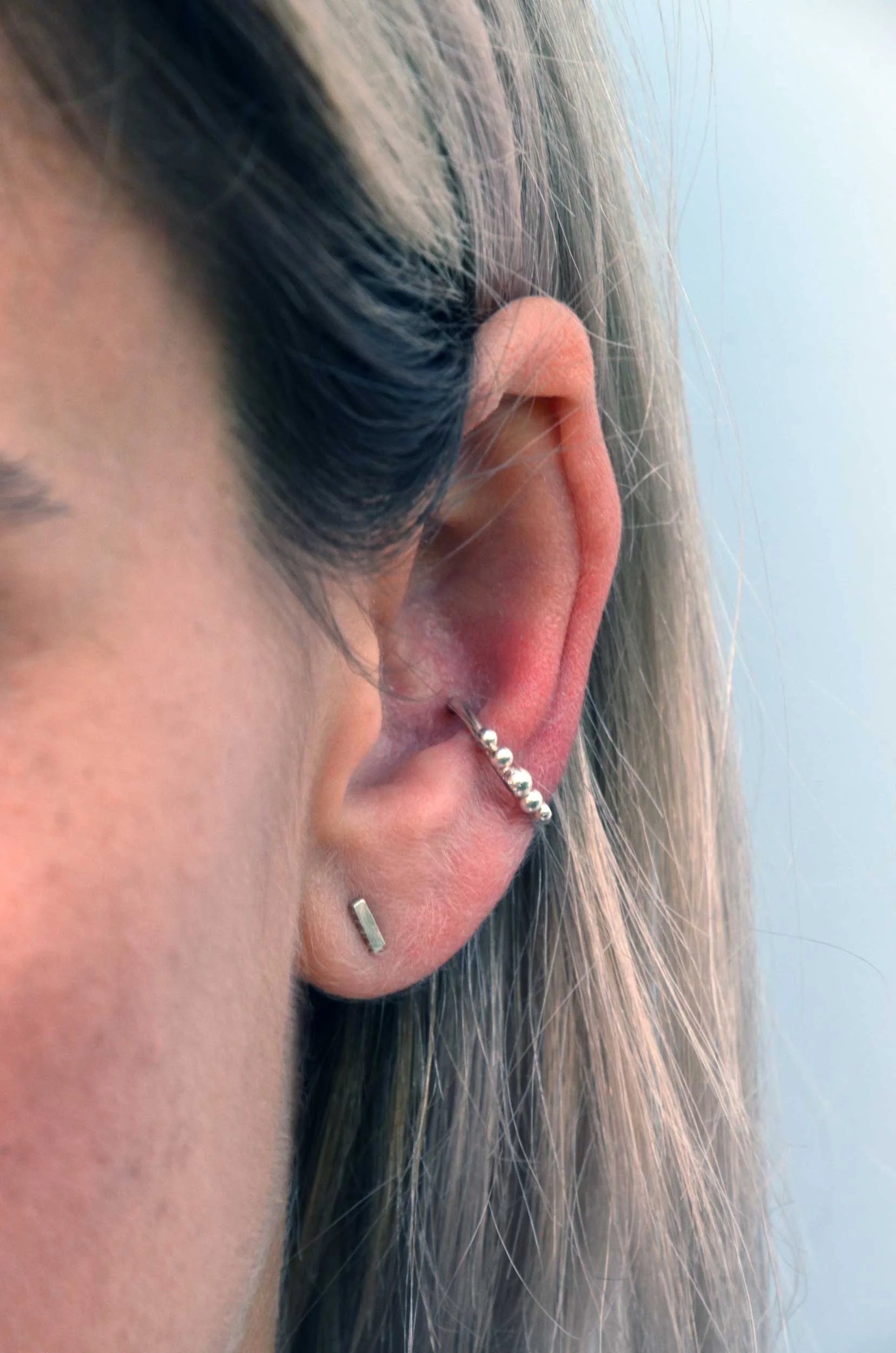 silver conch hoop with granulation on model