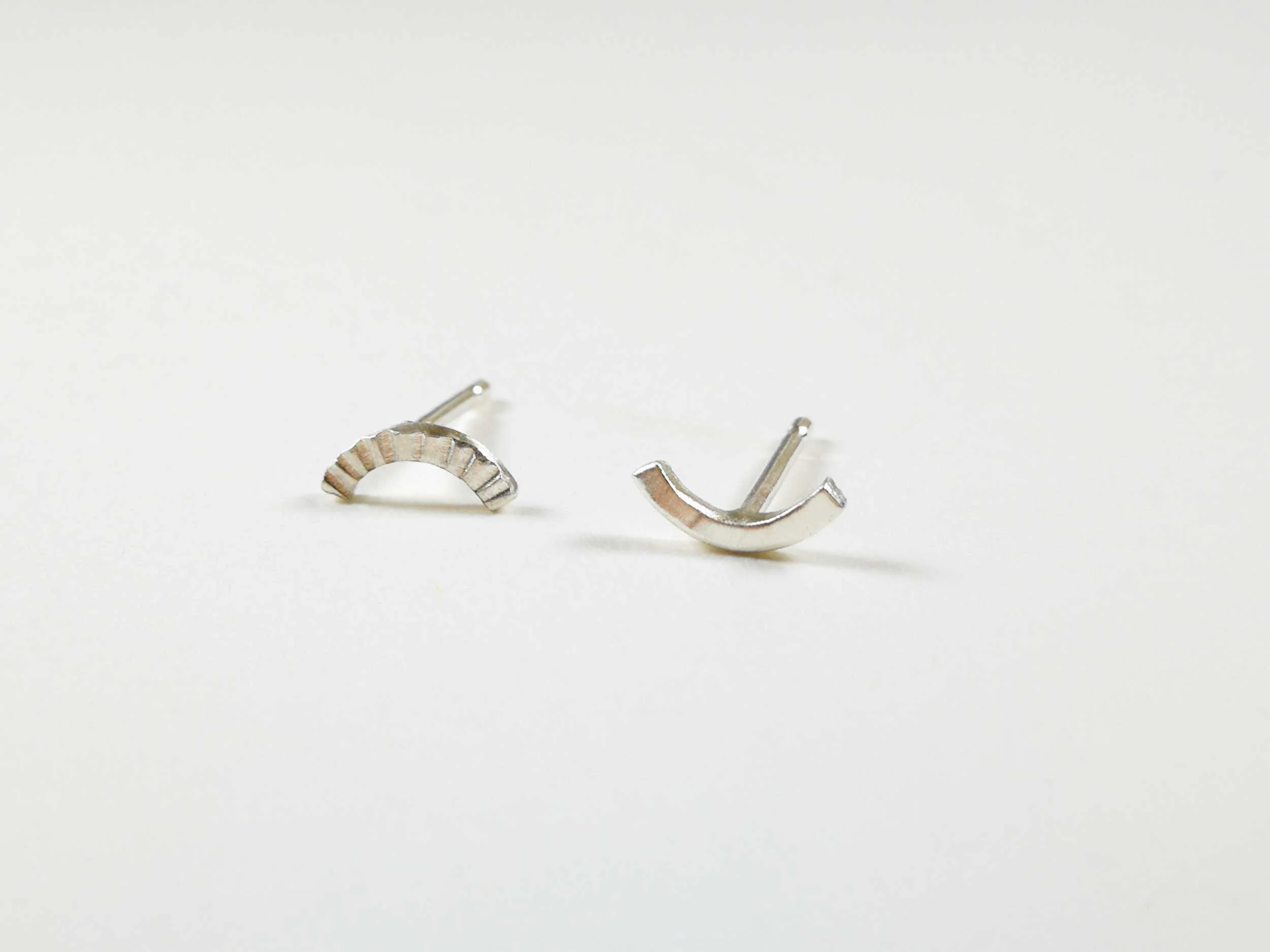 silver mismatched stud earrings