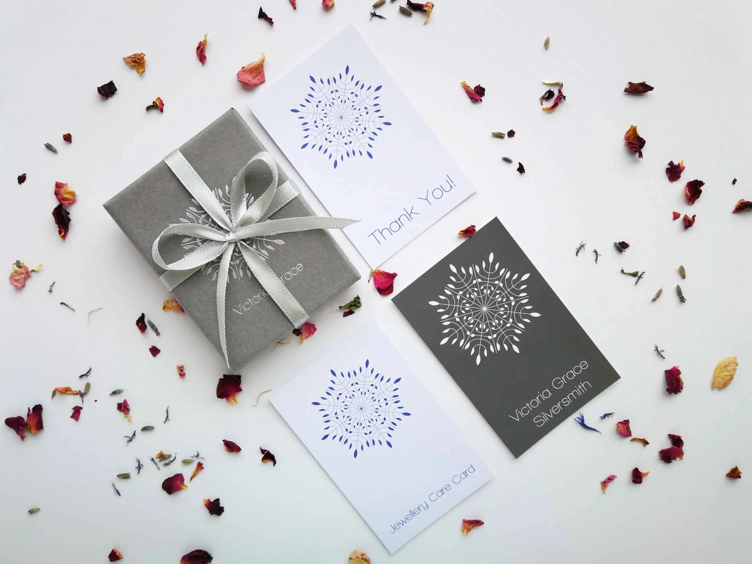 victoria grace studio packaging with embossed box and flower petals