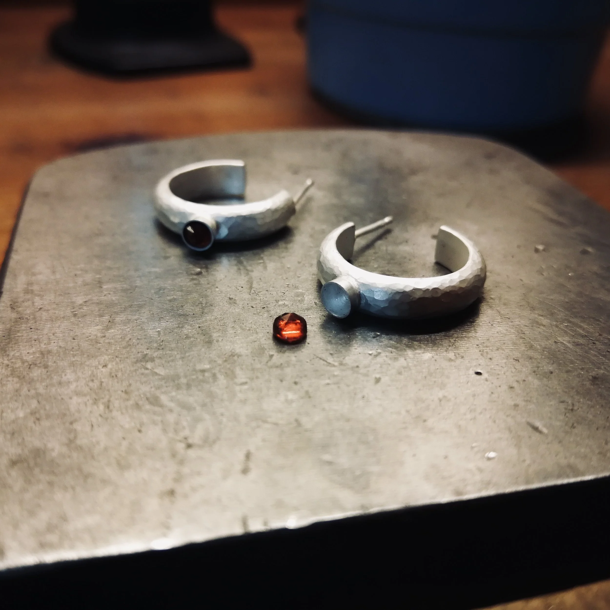 setting a garnet gemstone into an earring (Copy)