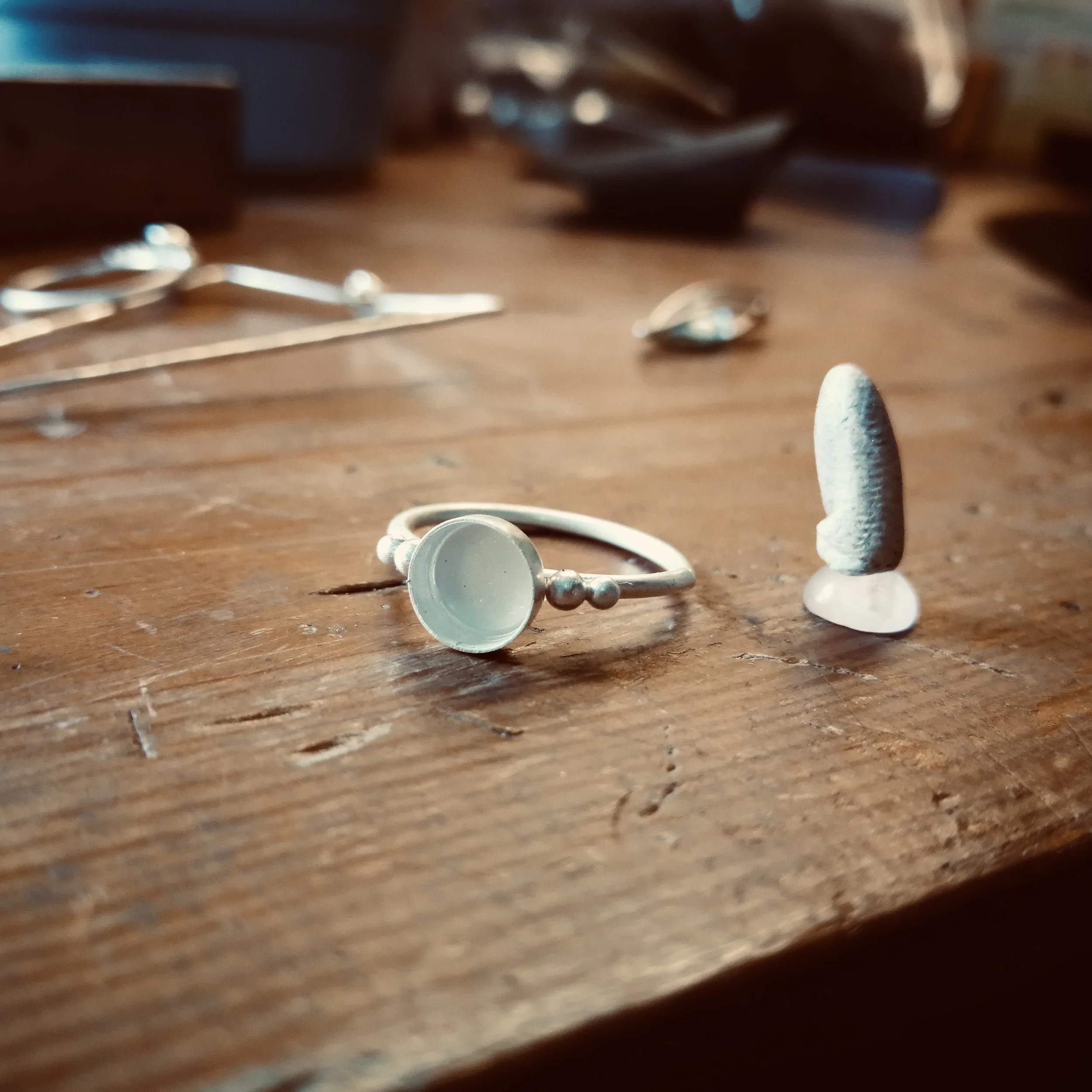 setting a stone into a conch hoop (Copy)
