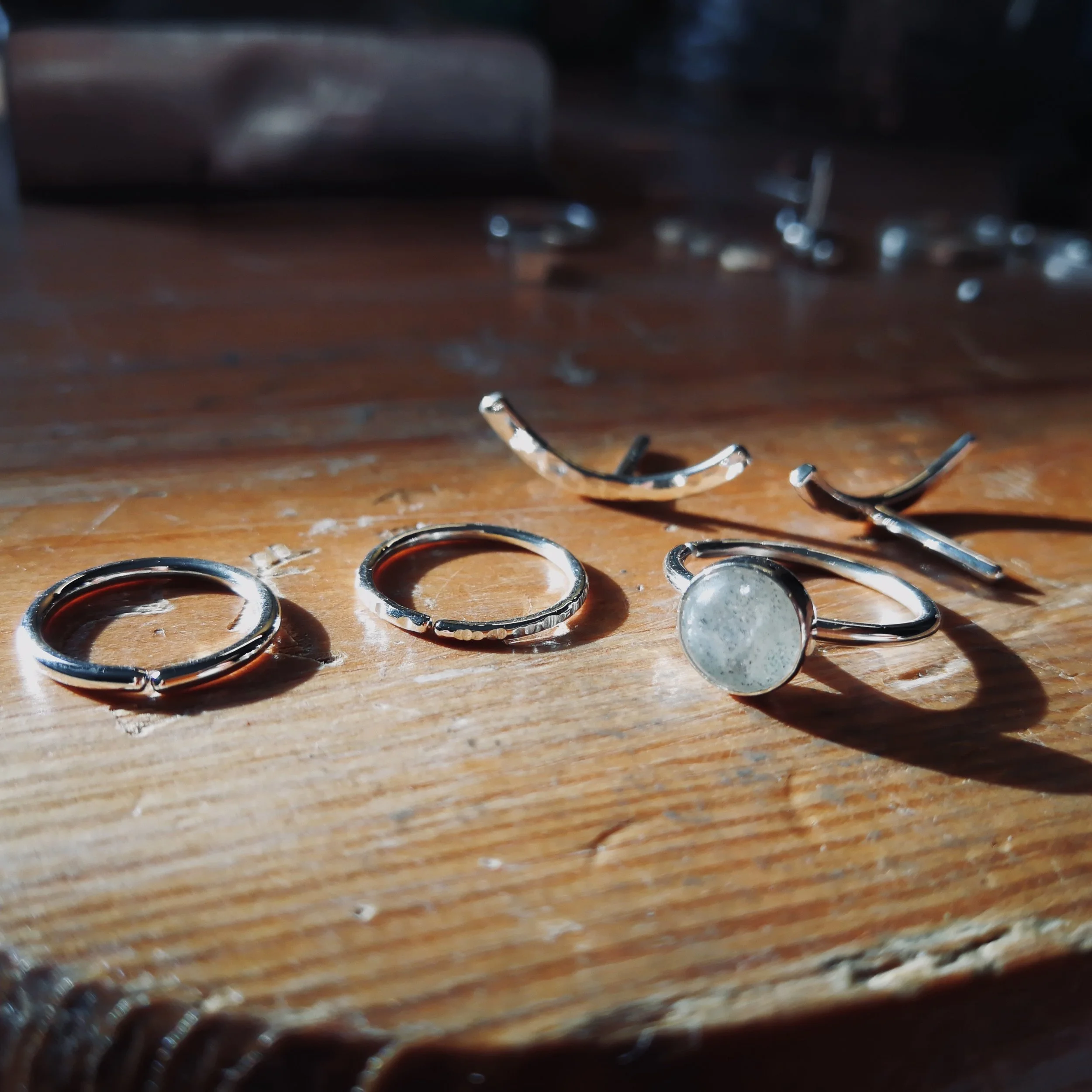 selection of conch earrings on jewellery bench (Copy)