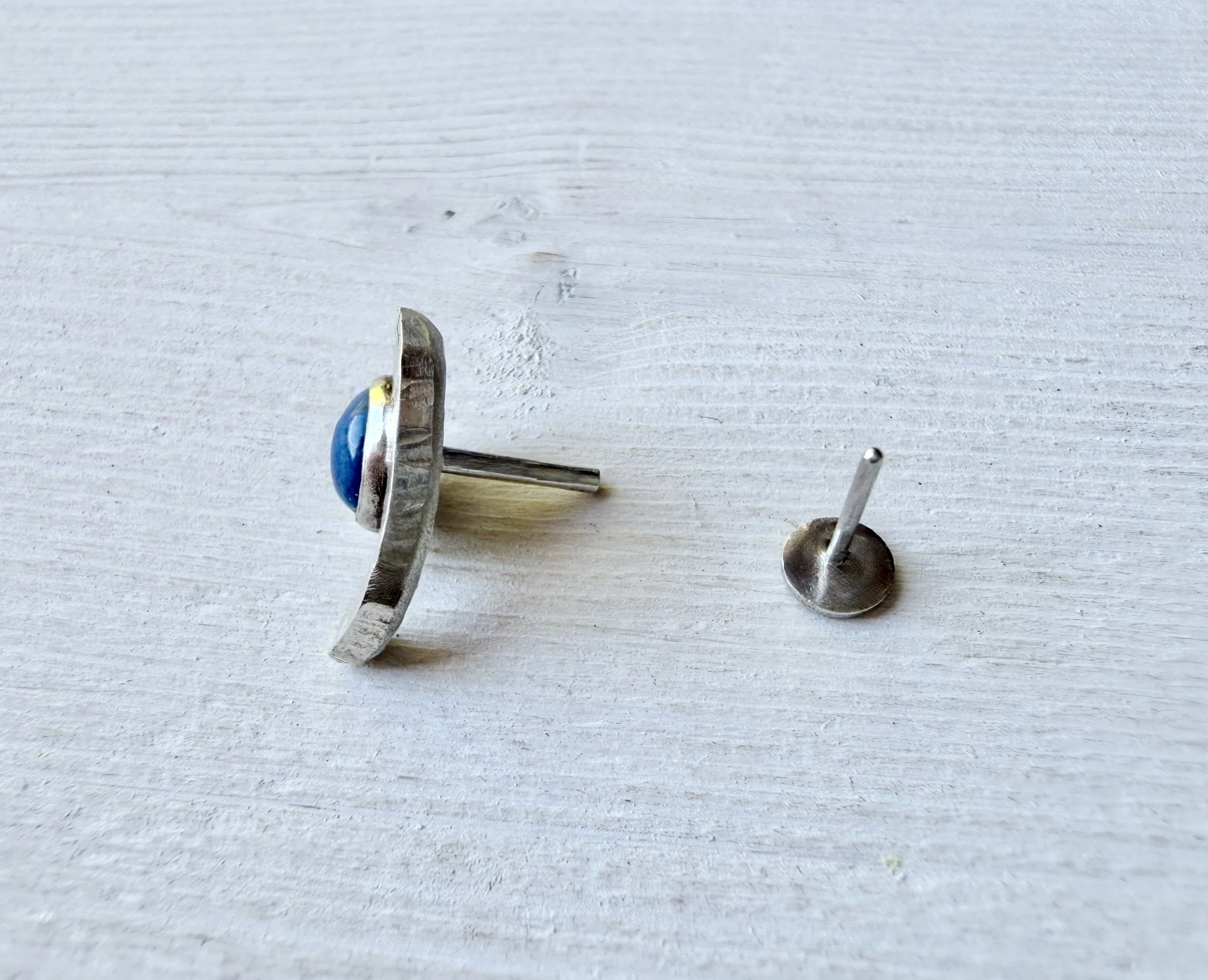 handcrafted lapis lazuli and silver conch earring showing the threadless post and press fit flat back