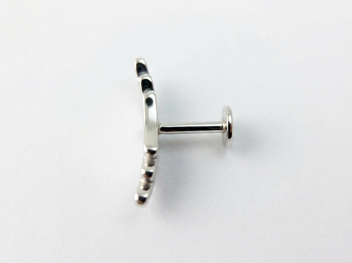 side view of custom made recycled silver conch earring showing the slight curve to fit the ear