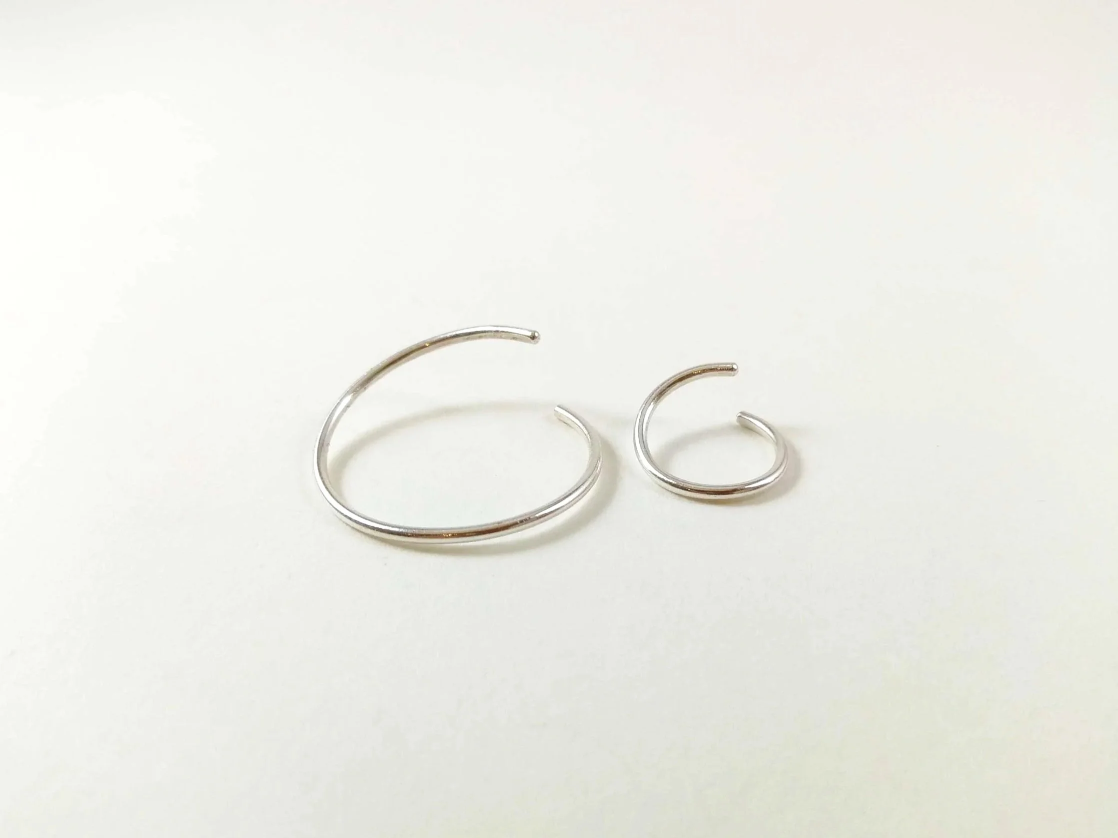 two-open-recycled-silver-endless-hoop-conch-earrings