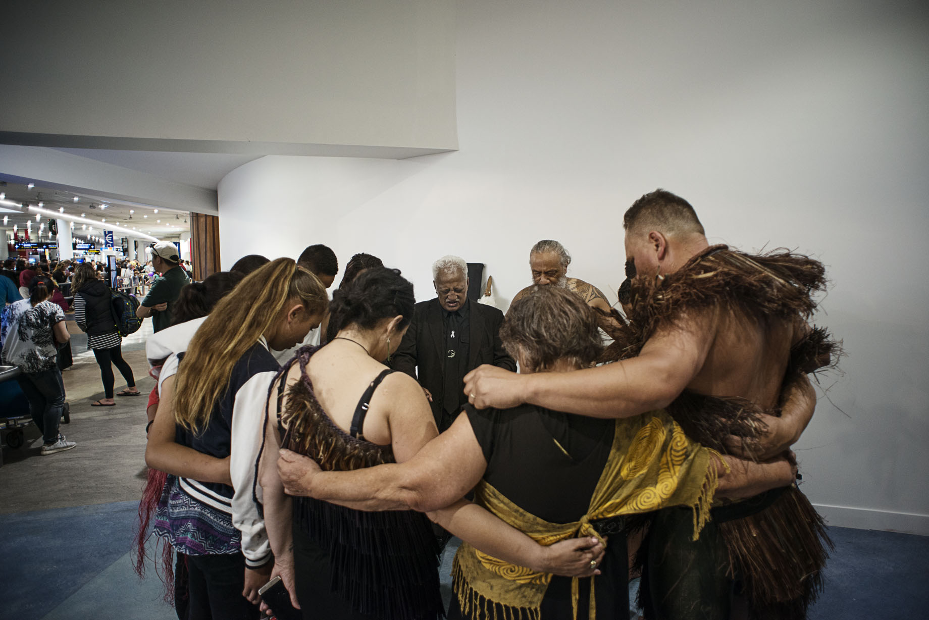 kaiHaka in prayer after the powhiri for Mya at Auckland Airport.