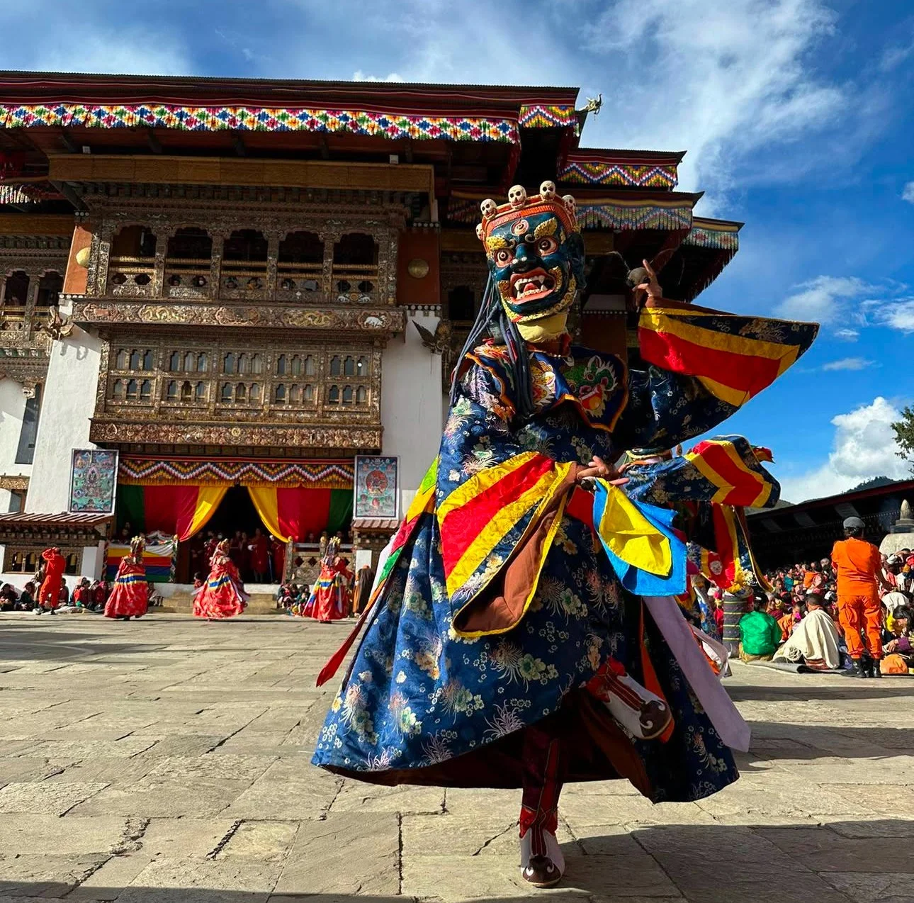 A traditional Bhutanese masked dancer at Gangtey Tshechu Festival, Bhutan, performing an ancient Buddhist dance. A must-see cultural experience for travelers on Bhutan festival tours.