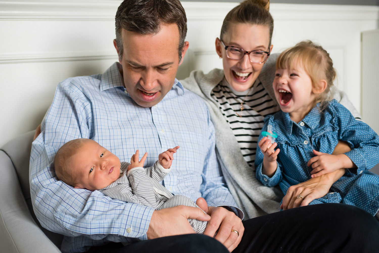 famliy with newborn baby and little girl laughing_.jpg