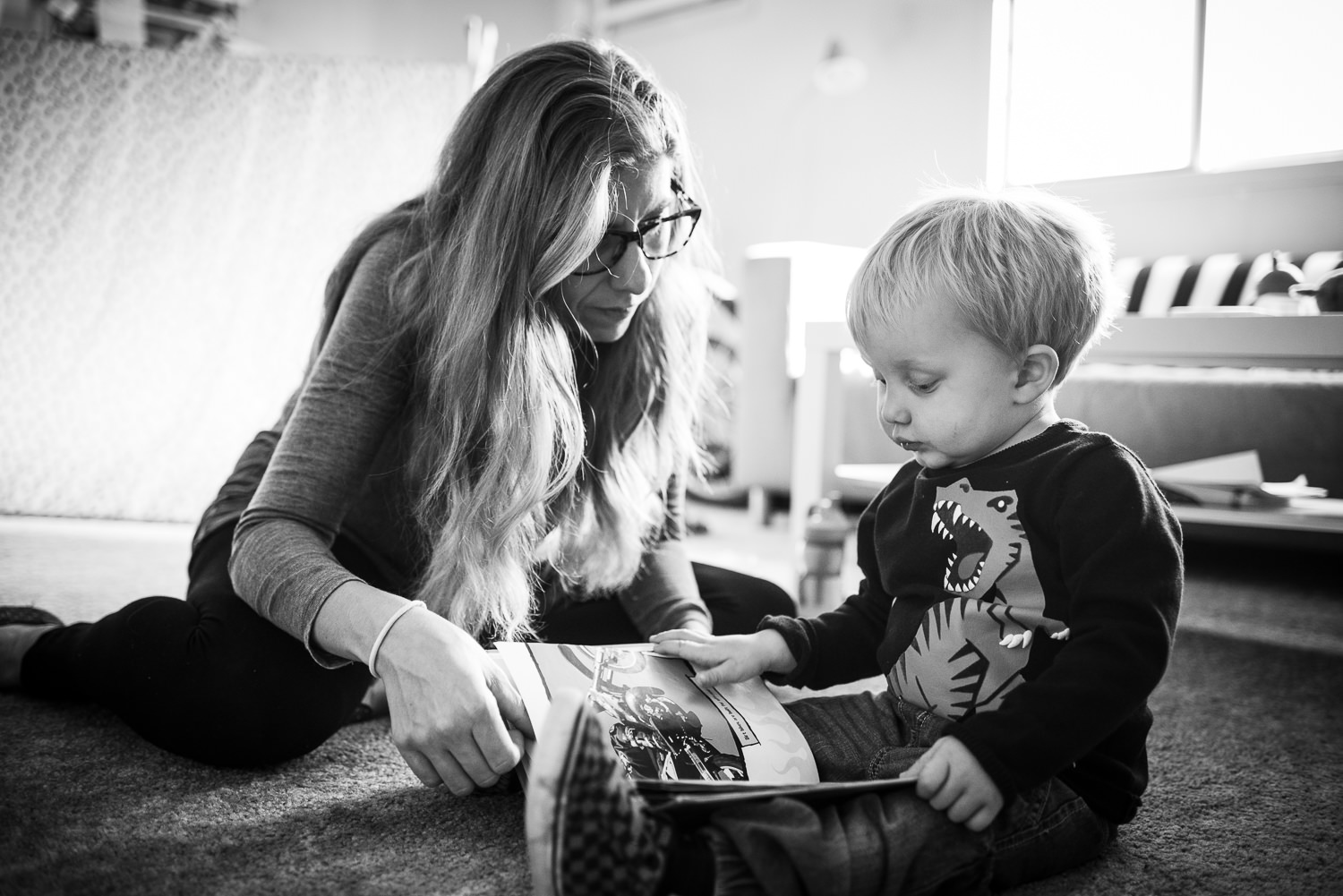 mom reading her little boy a book in Lincoln Nebraska.jpg