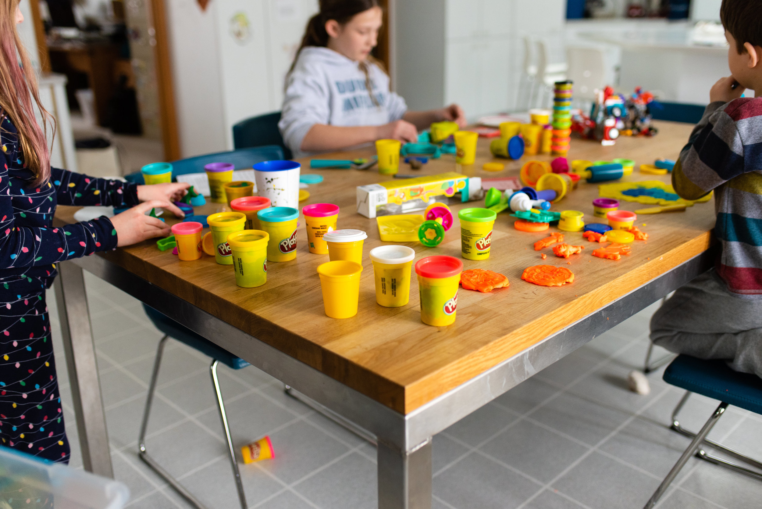 children playing with play-doh at a table.jpg