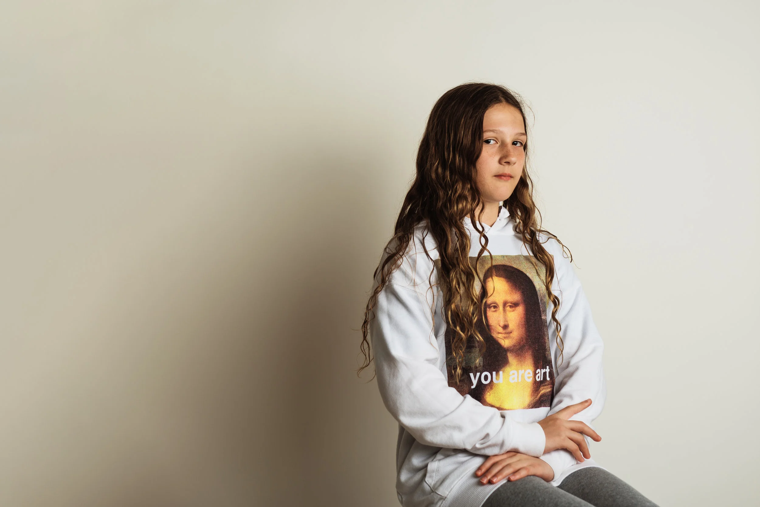 tween girl with long curly hair mona lisa sweatshirt.jpg