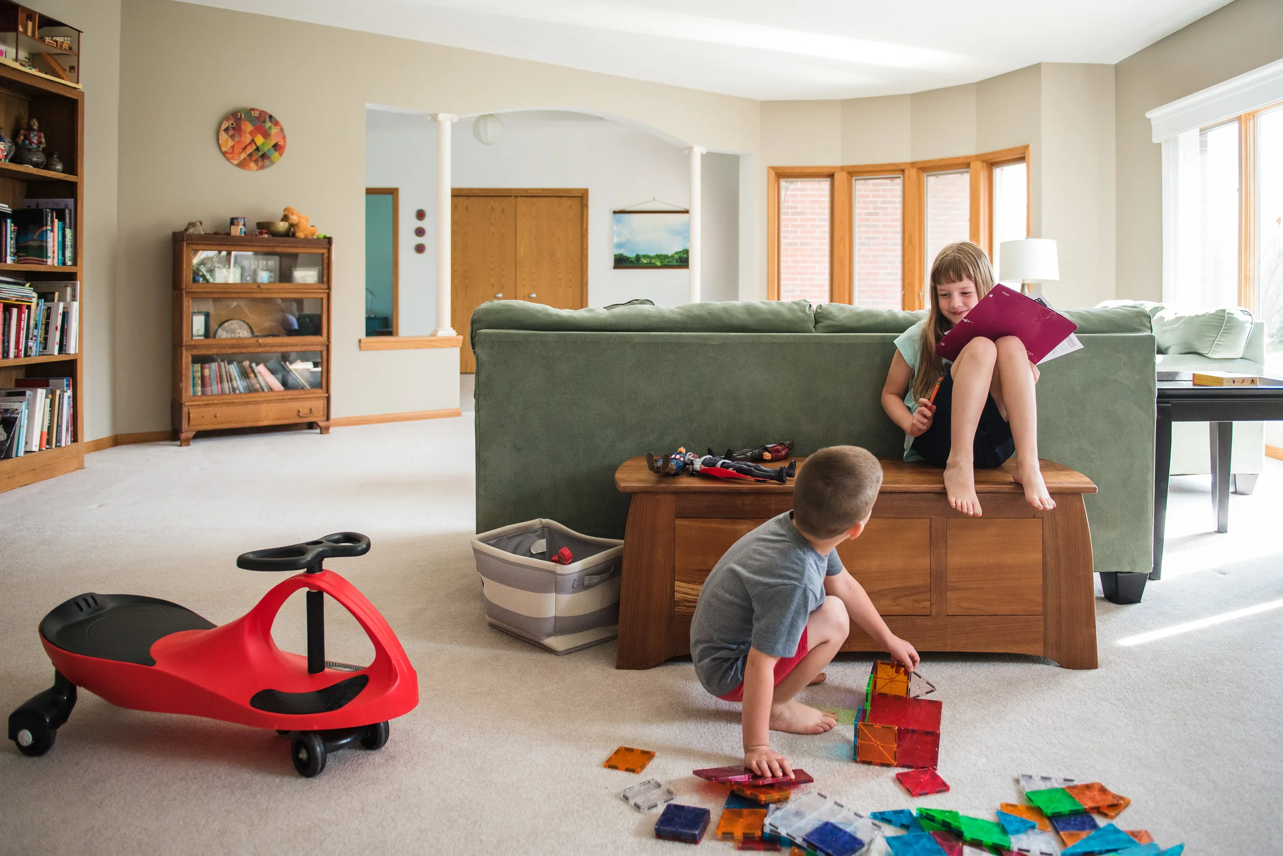 children playing in a living room with magnatiles.jpg