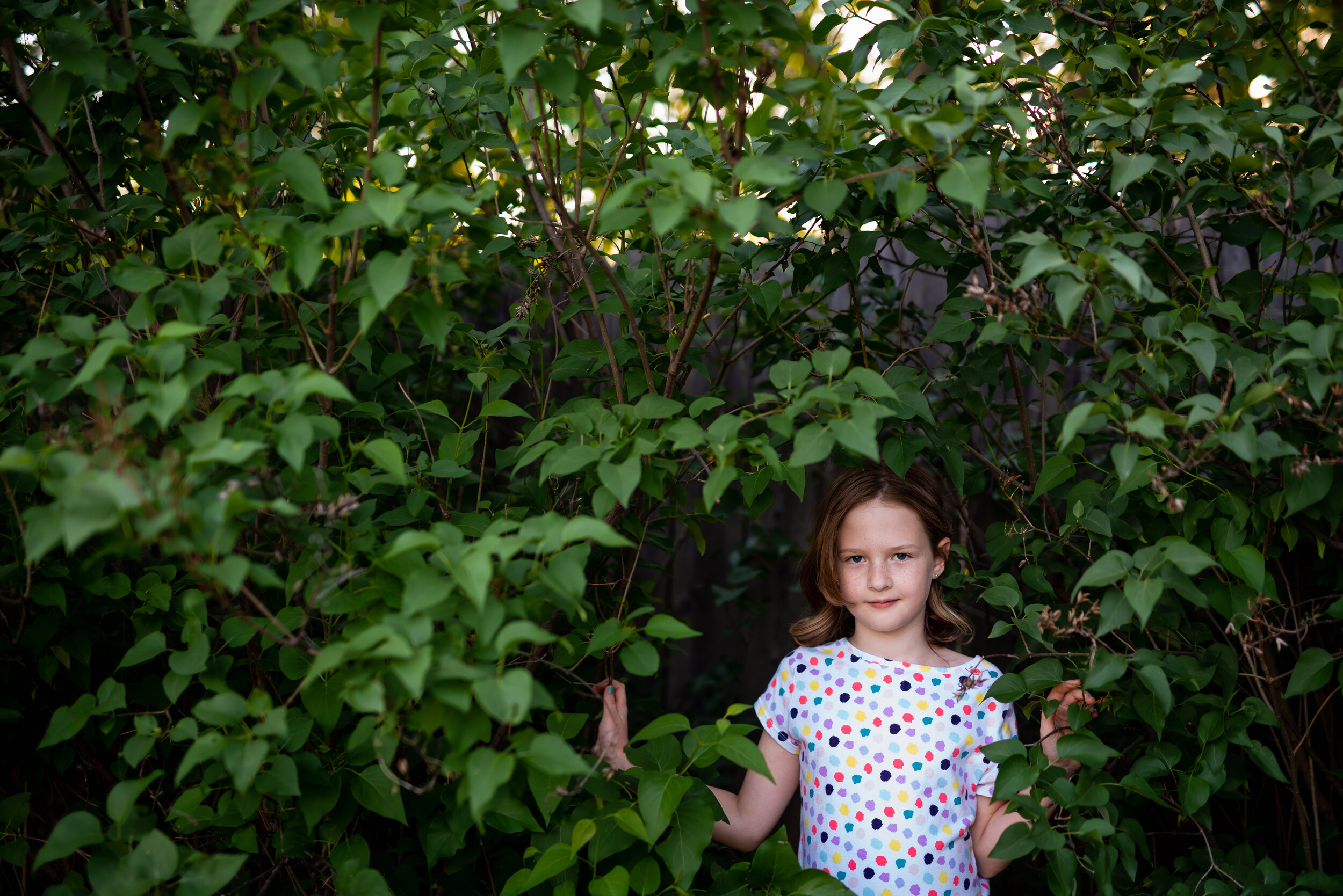 potrait of a young girl in lilac bushes_.jpg