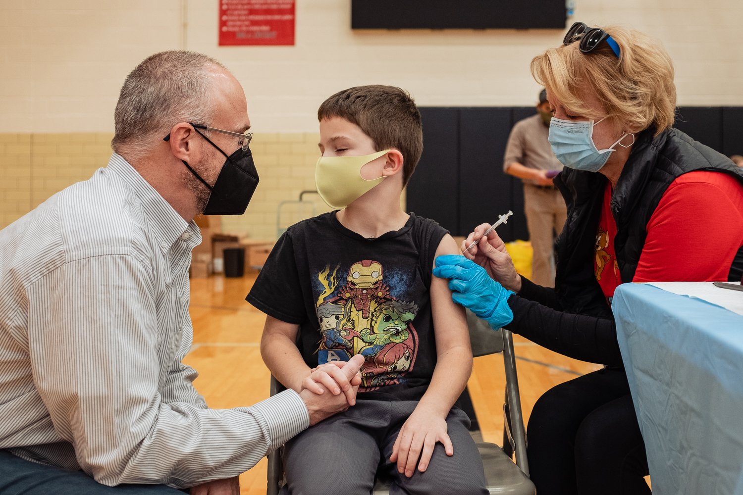 little boy getting his first covid vaccine.jpg