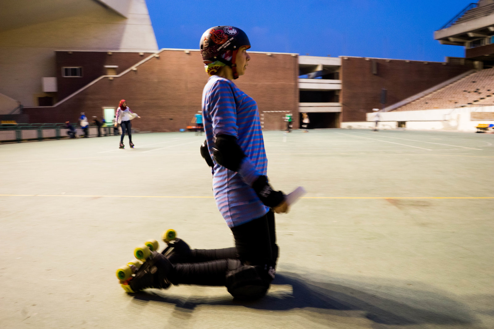 Nouran El-Qabbany, 27, a graphic designer, demonstrates safety measures to new players. "If you must fall, and you will fall, you should try to fall to the front not the back," she says. Photo: Marwa Sameer Morgan