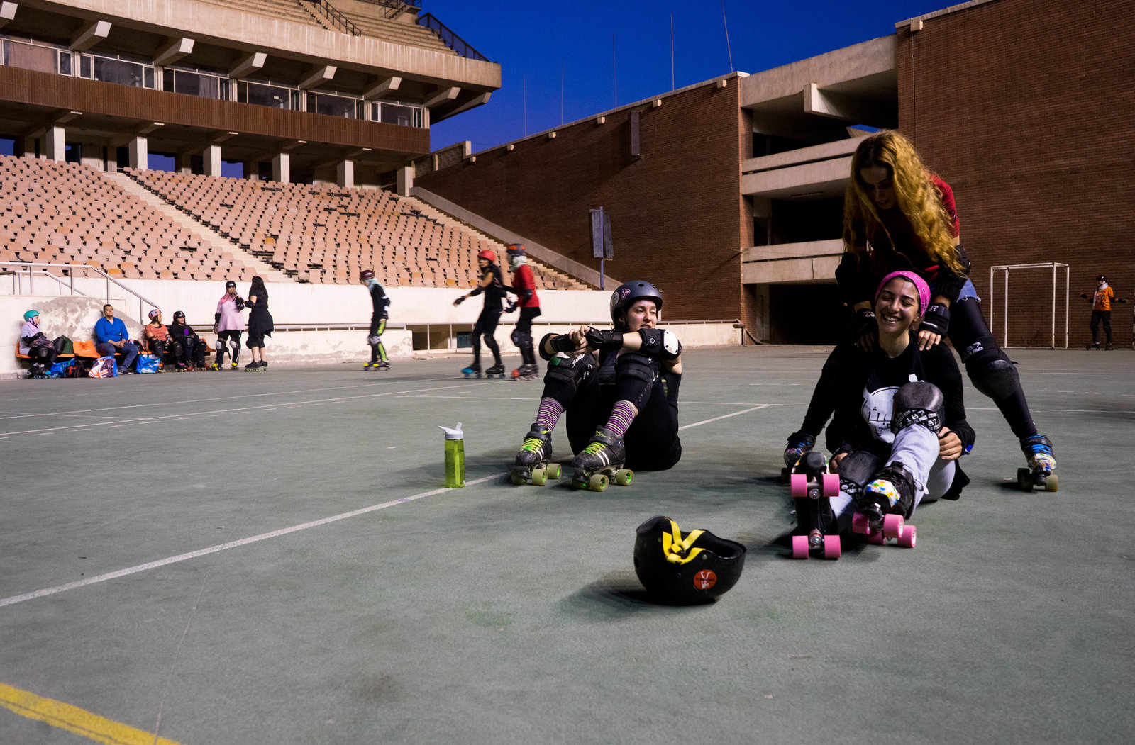 Sumer Abdelnasser (lower right) laughs at Nermine Abi Aad's joke during a practice break. Photo: Marwa Sameer Morgan