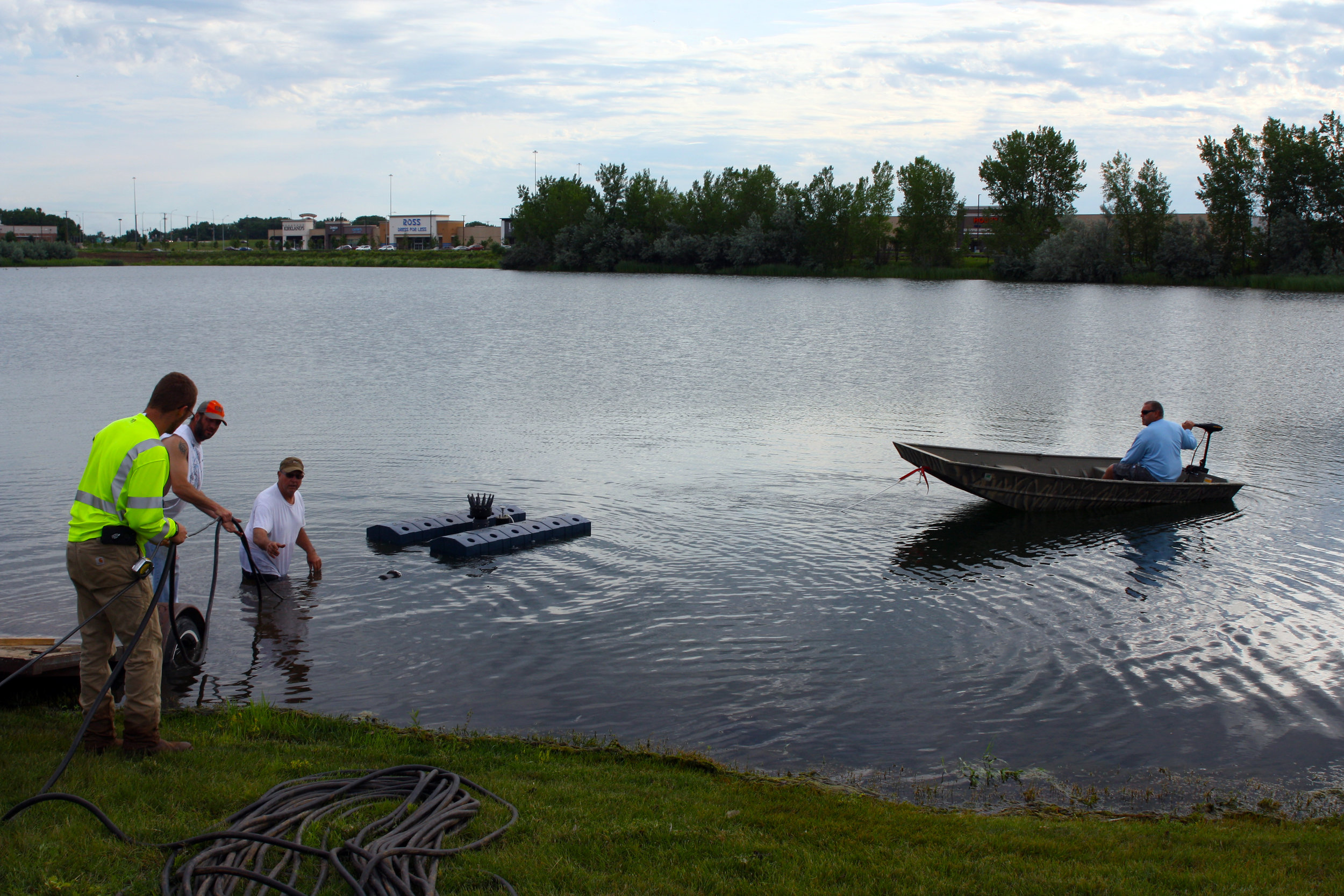 A small boat — the only time you’ll see a motorized boat on the lake — pulls the fountain out to its location in the southern part of the lake.