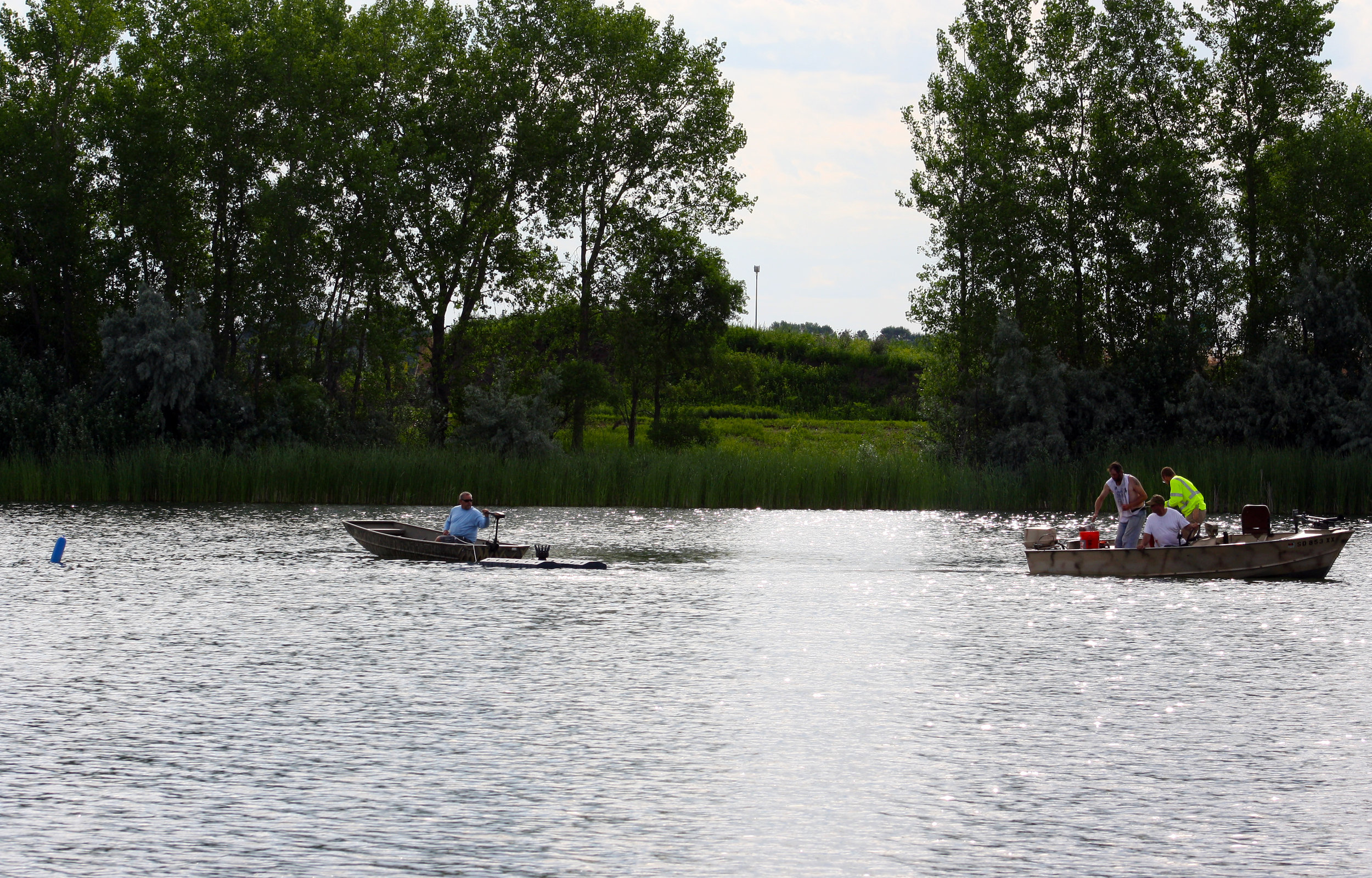 Two small boats worked to move the fountain to its proper location in the lake.