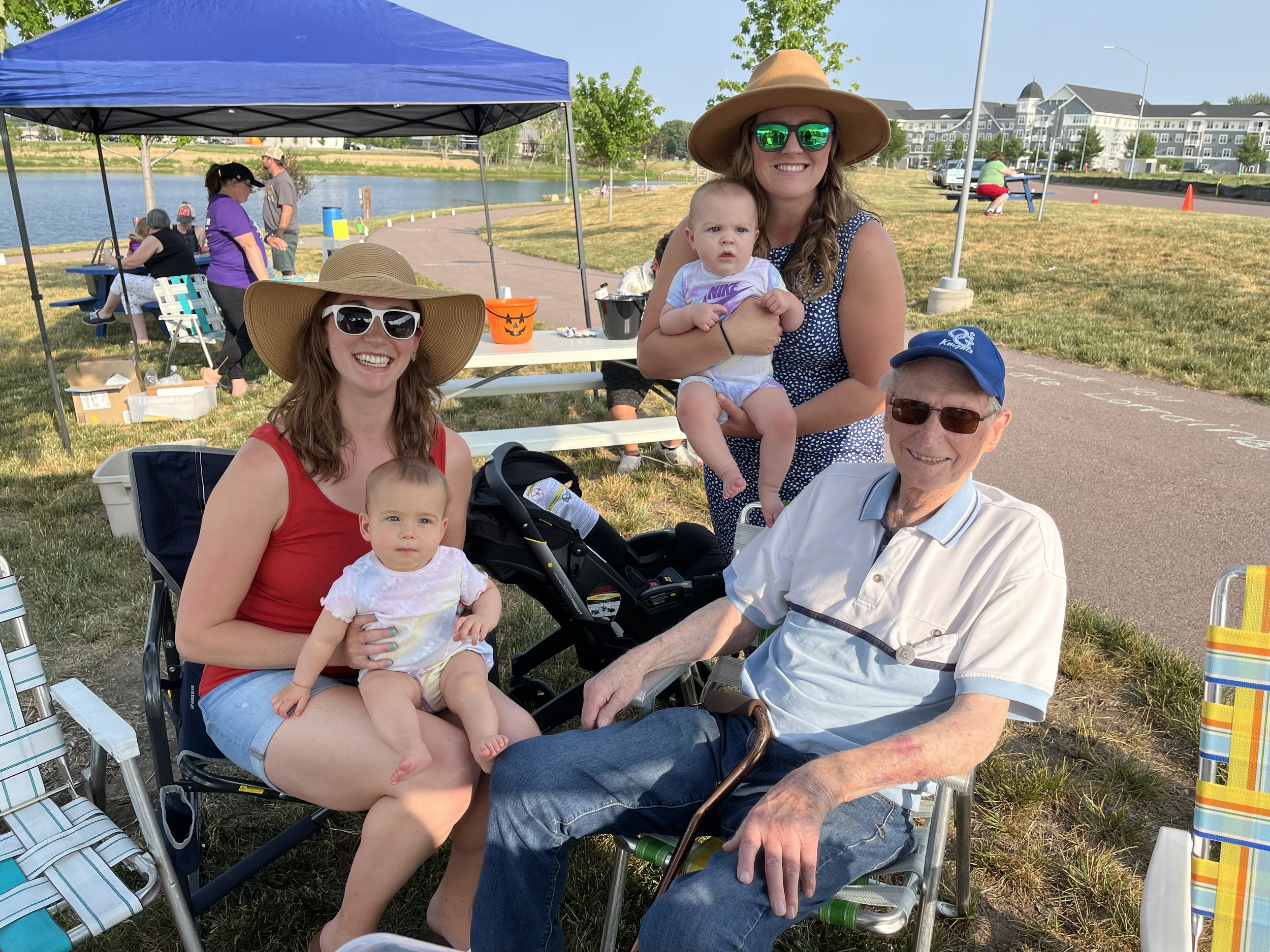  Visiting with granddaughter Katie Loomis, great-granddaughter Riley, granddaughter-in-law Jamie Monnin and great-grandaughter Ellie at an Alzheimer's Association event at the lake.  