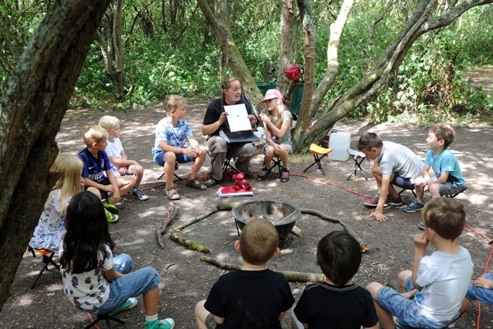 Experiencing the joy of the open air classroom on a make-it-yourself mud slide!