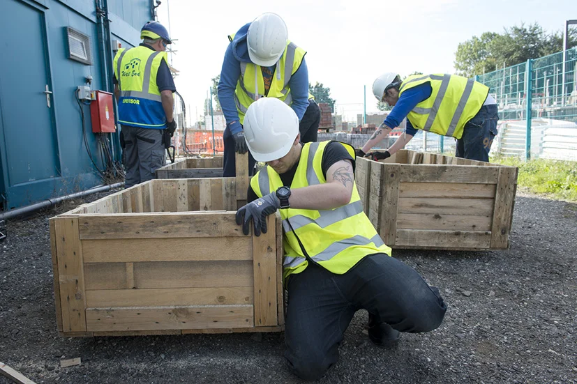 Volunteers learn skills in carpentry and working as part of a team