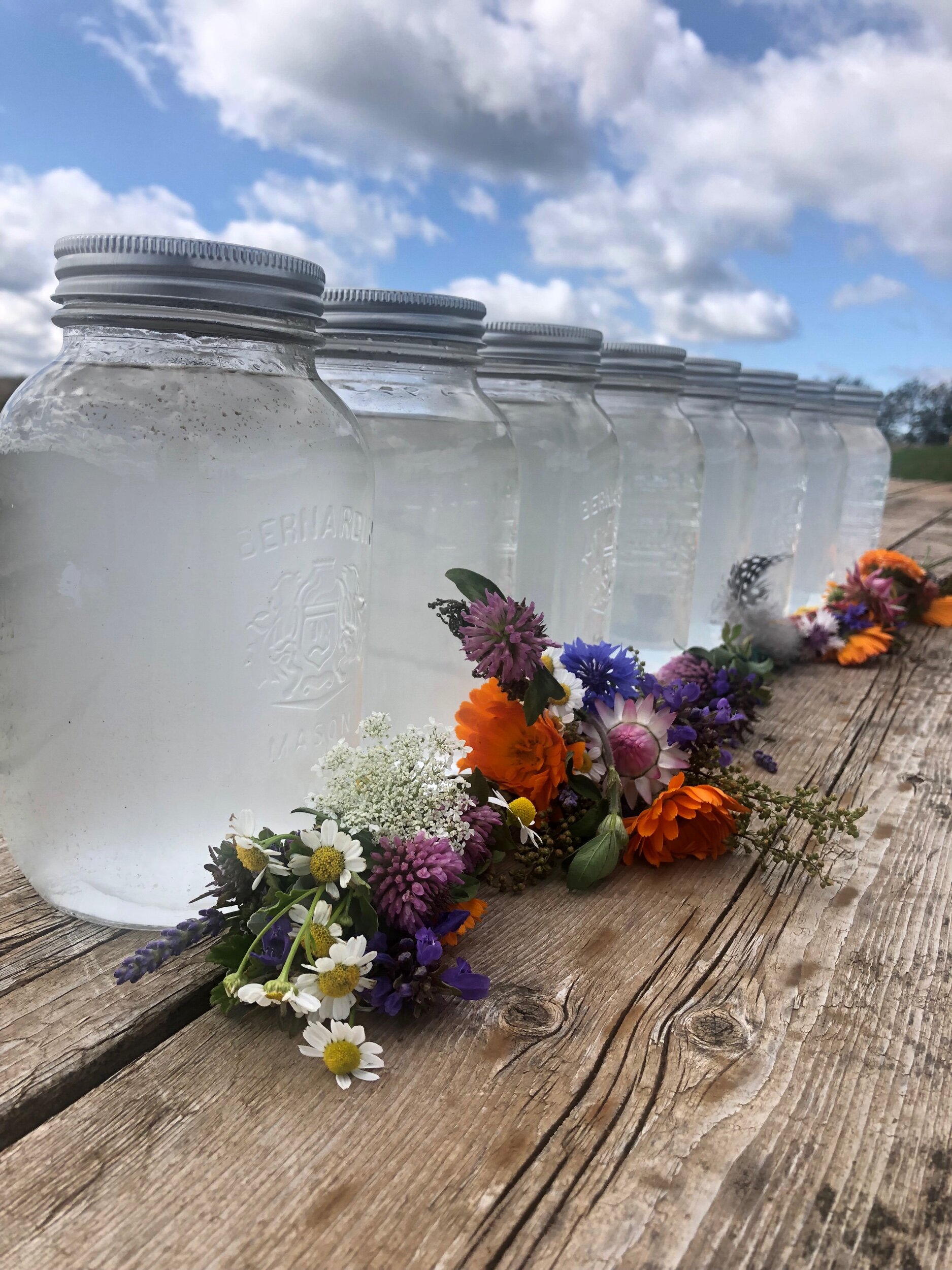 Rose Geranium Hydrosol from first batch to last. You can see how the first few are more cloudy with essential oil. The smell is stronger too. You could mix them all together or keep them separate depending on smell preference. We also have our smudge sticks displayed, it doesn’t have to just be white sage to smudge! We all have a great mix of medicinal herbs!