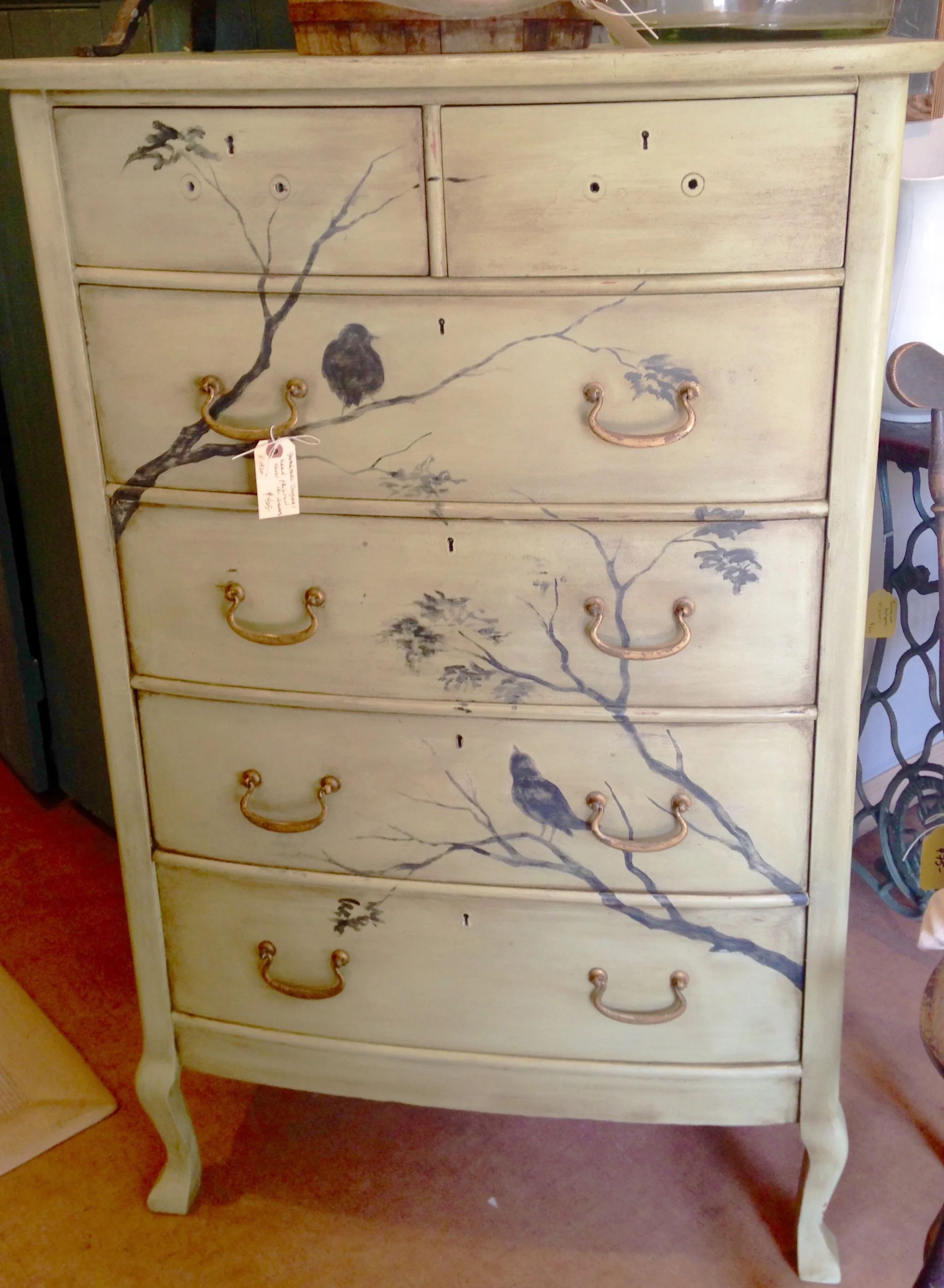 Julie’s artistry is applied to an early 1900’s chest of drawers. This piece sold in 20 minutes!