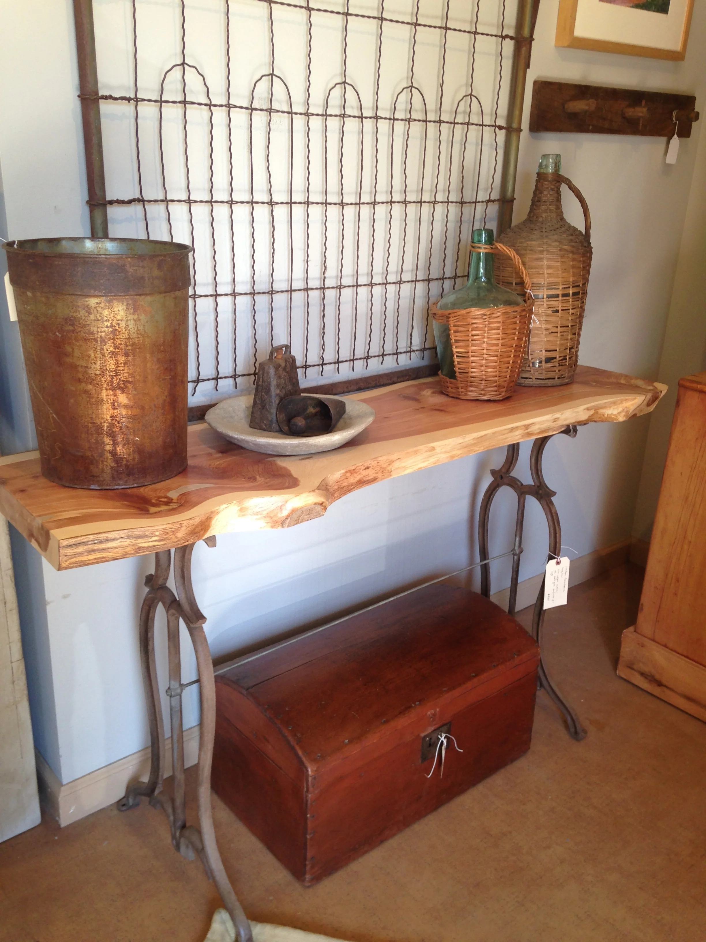 Live-edge wood is timeless. This ornamental cast iron antique lathe base provides support without distracting from the natural beauty of the cedar.