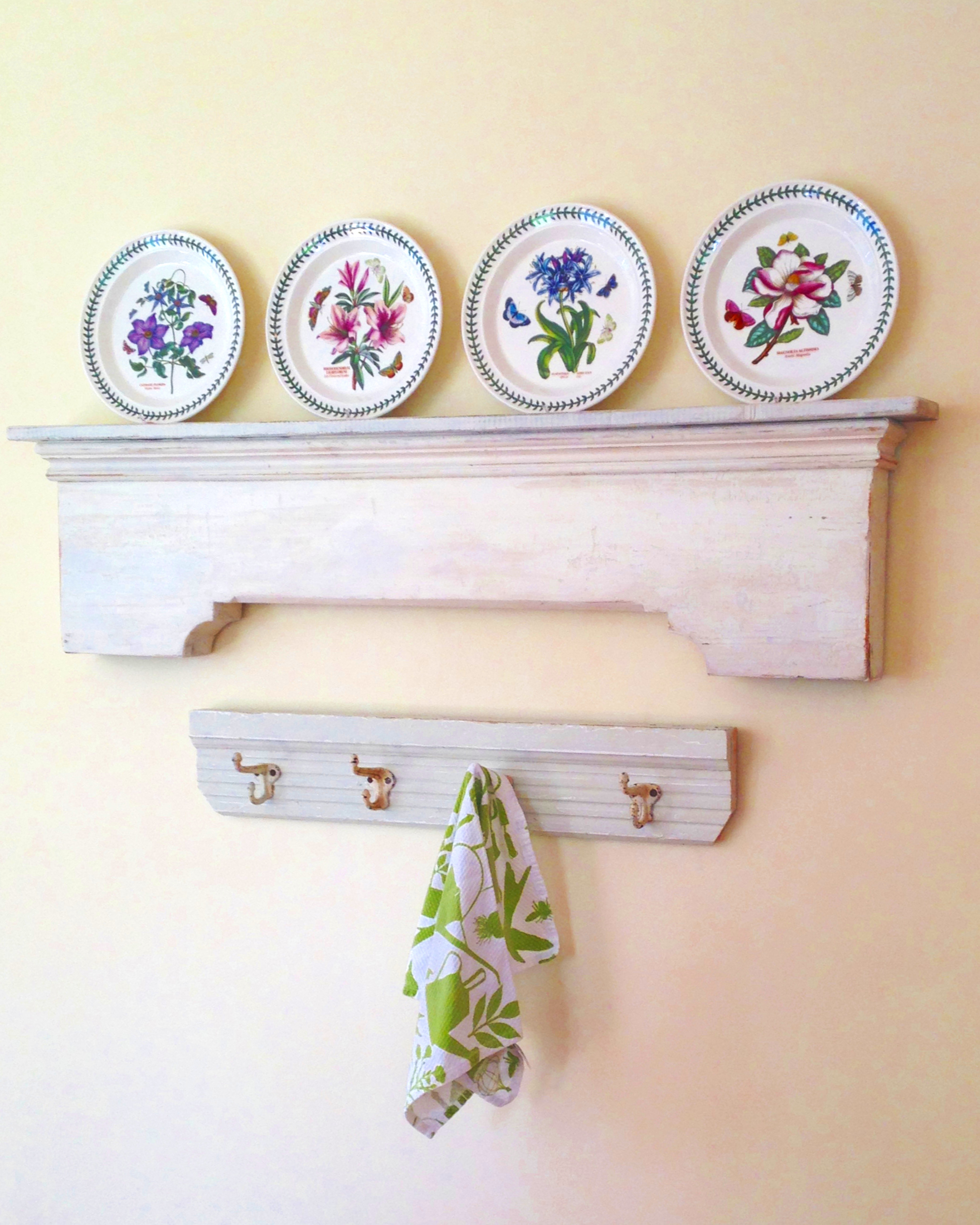 Simplicity itself....sections of an old mantle and a chair railing re-purposed as shelf and hooks in a clients kitchen.