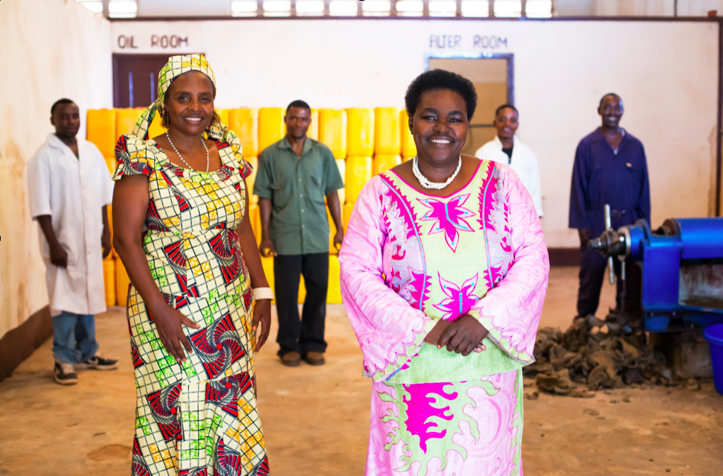 Joyce Mbwette, one of Selfina's proud clients with Dr. Victoria Kisyombe at her Sunflower Oil Factory in Tanzania.