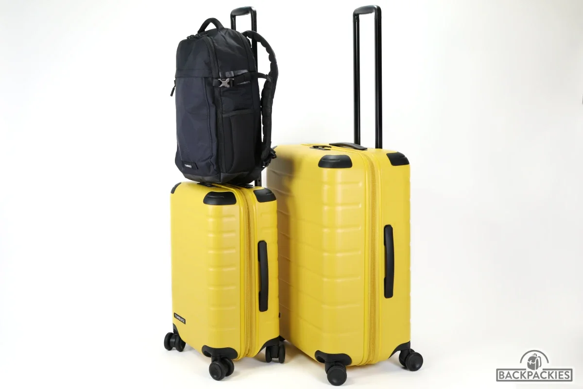 Timbuk2 FreeStyle carry-on and check-in luggage with Timbuk2 Division backpack on top for size and capacity comparison