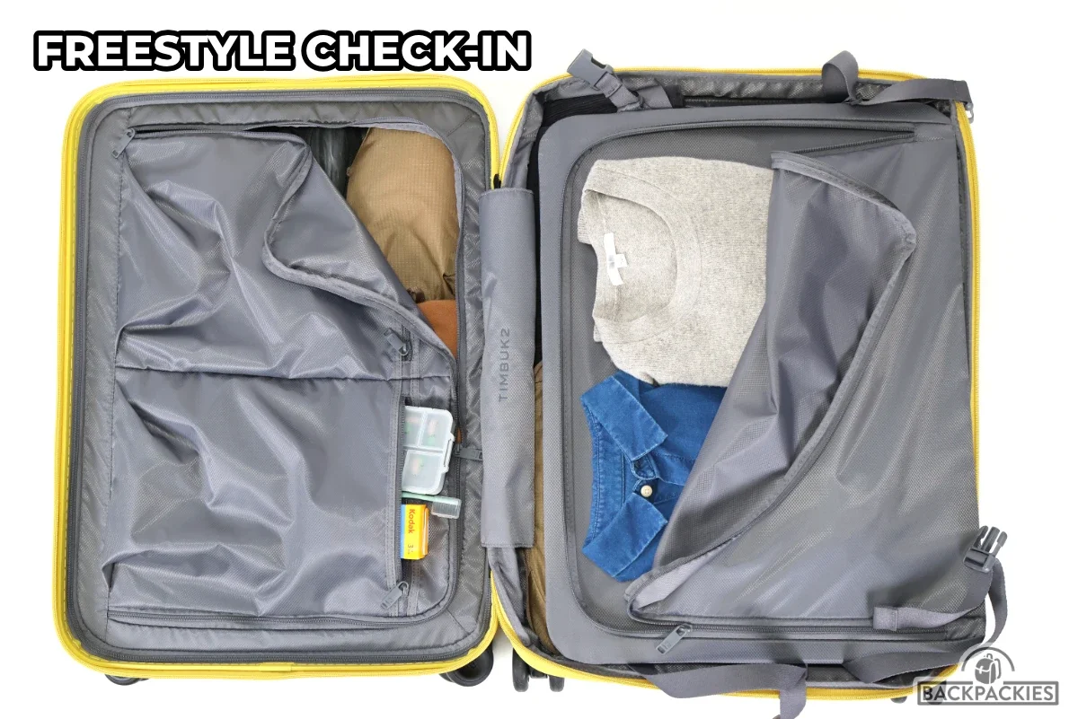 Interior pockets of the Timbuk2 FreeStyle Check-In, featuring the same layout as the carry-on but scaled up for larger packing capacity.