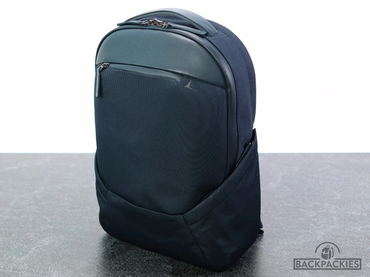 Photo of the navy Troubadour Apex Backpack with a 25L capacity, designed as a professional men's work backpack. The backpack is made from highly water-resistant materials and has a sophisticated design with a slim profile.
