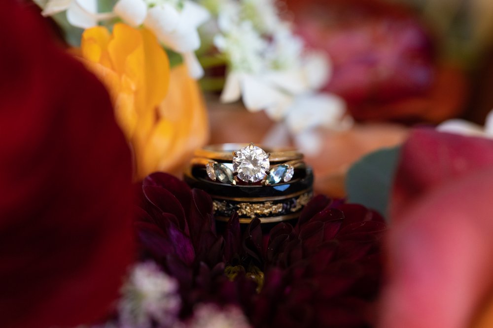Wedding Rings set in florals at the Homestead at Deer Creek Valley Ranch