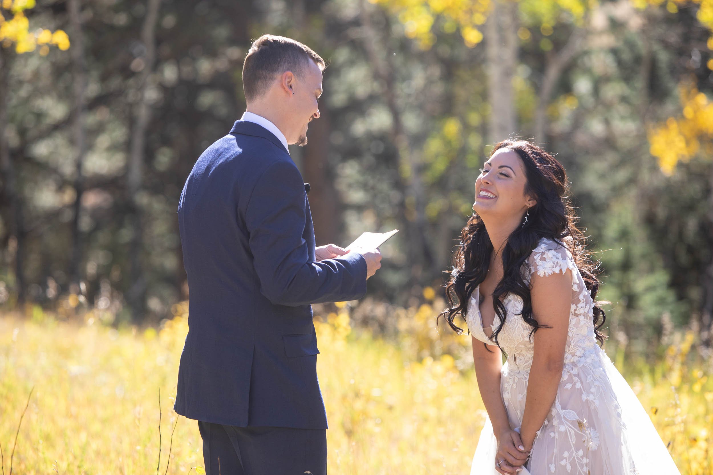 Reading Vows in the yellow fall leaves at Deer Creek Valley Ranch