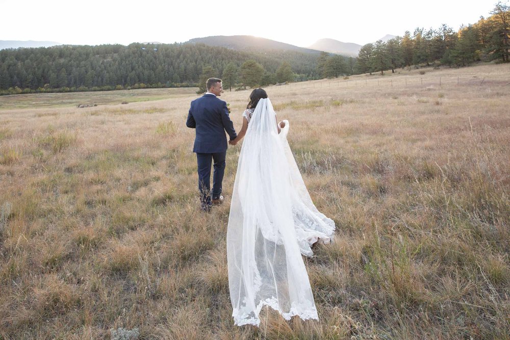 Bride's veil in the fields of at Deer Creek Valley Ranch at sunset