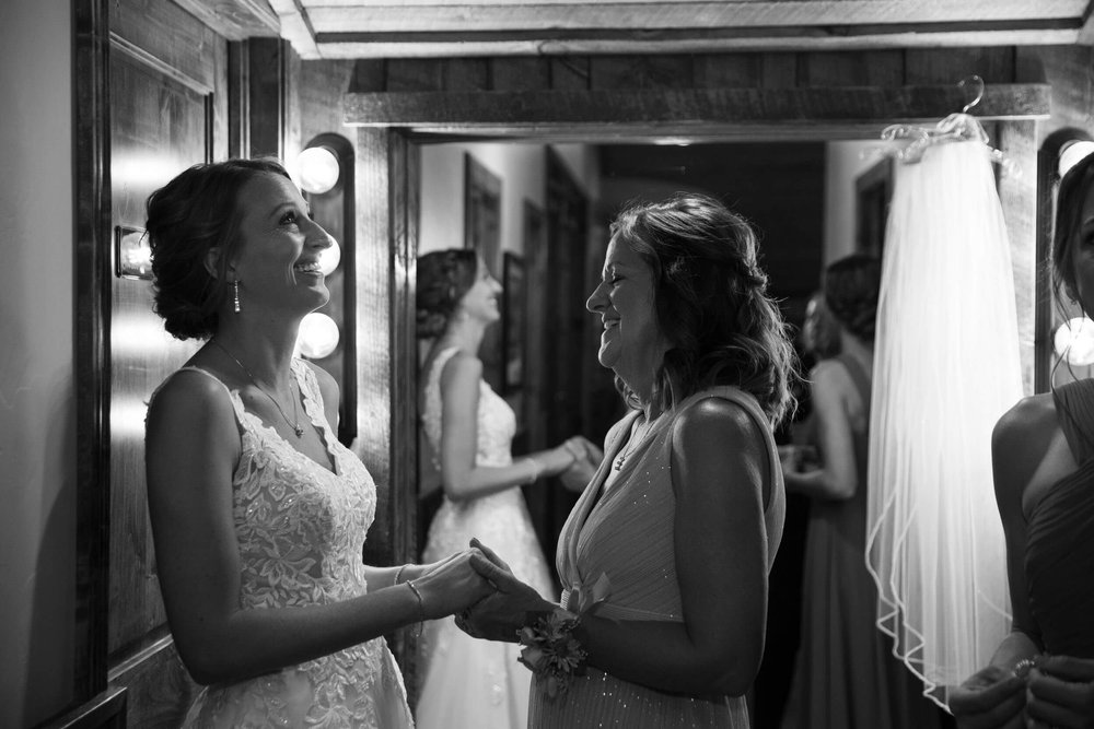Emotional bride and mother of the bride at Spruce Mountain Ranch