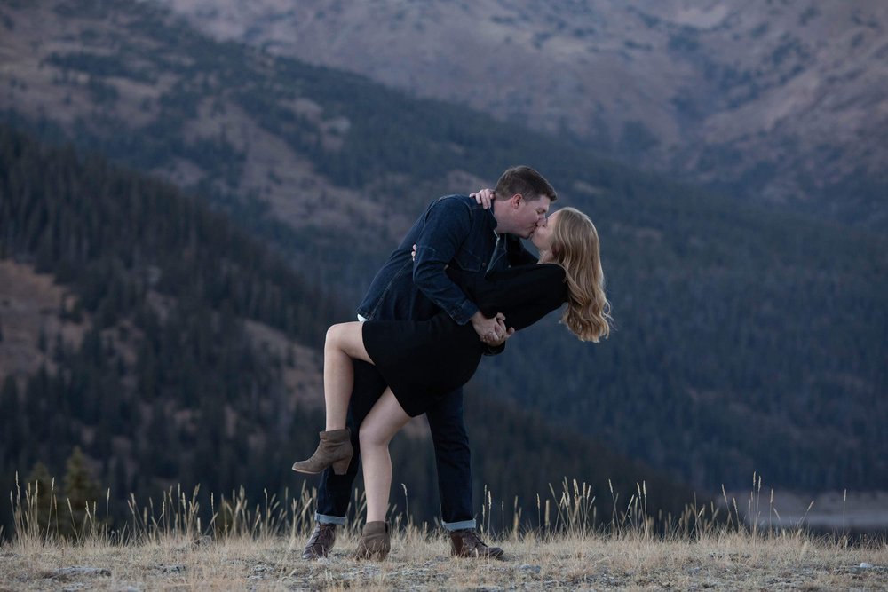 Couple kissing in the mountains  in Colorado