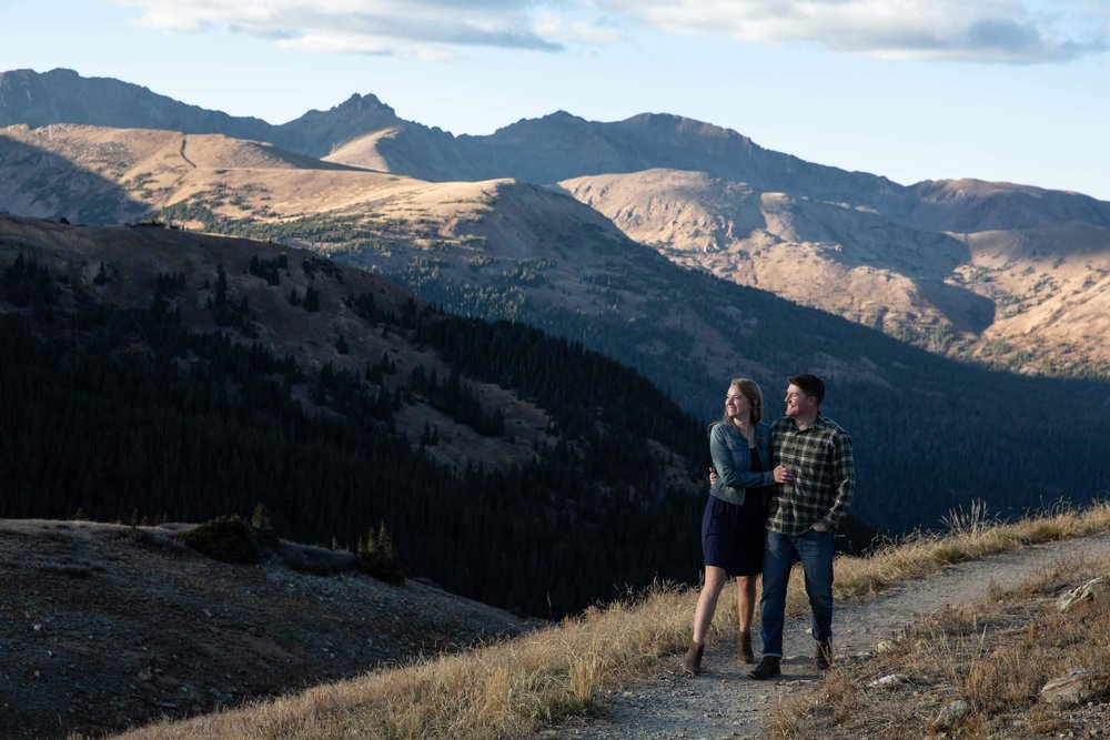 Couple walking on a mountain path in Loveland PAss
