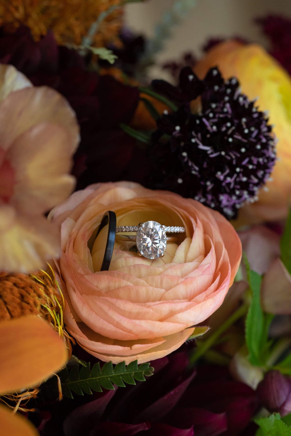 Wedding Rings in florals at Grant Humphreys Mansion by CliftonMarie Photography