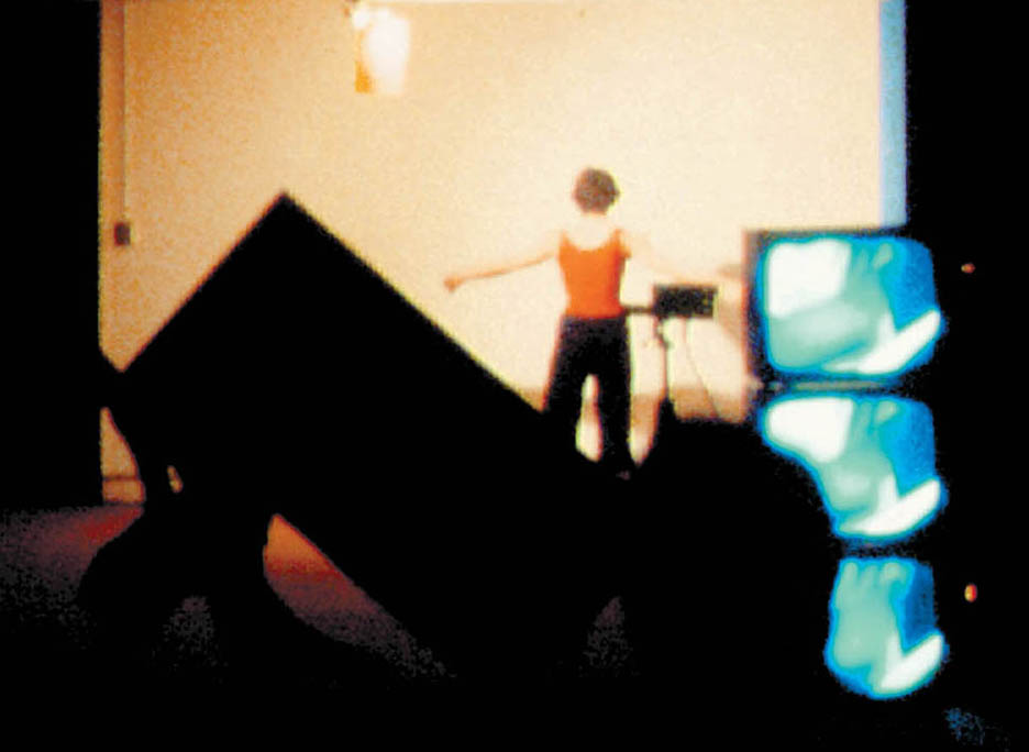  Still from Ellipsis, 1978, by Julie Harrison, a live performance at the Experimental Television Center, Binghamton, NY, including interaction between 4 dancers, 3 video cameras, and prerecorded videotapes sequenced/switched to 7 monitors. 