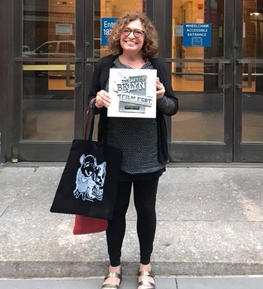 Christine at the art of brooklyn film festival with her outstanding documentary award.