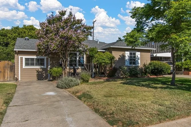 New listing in Tahoe Park! This adorable 3-bed home sits on a beautiful tree-lined street and features hardwood floors, a cozy wood-burning fireplace, indoor laundry, and French doors opening to a versatile third bedroom or office. The spacious backy