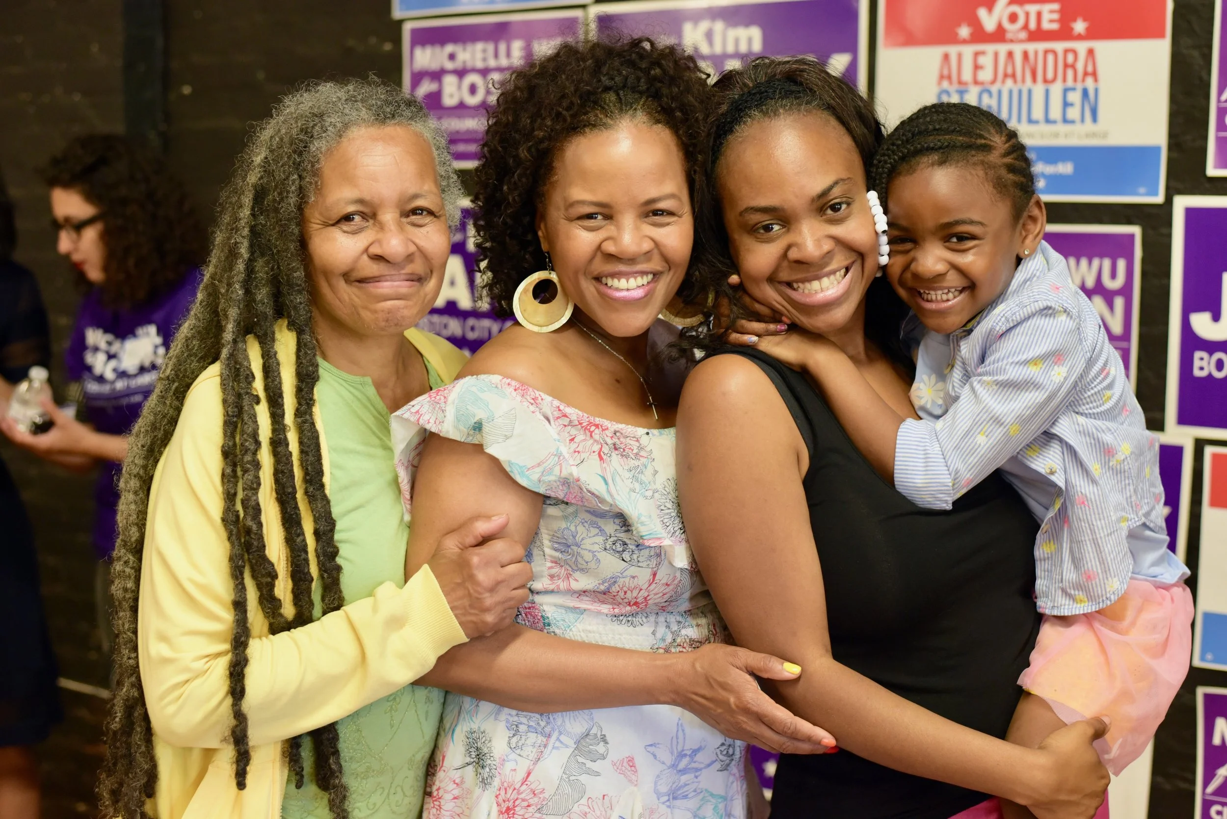Boston City Councilor KIm Janey with her mother, left of Kim, and her daughter, and granddaughter at her campaign office kick off event in June 2019.