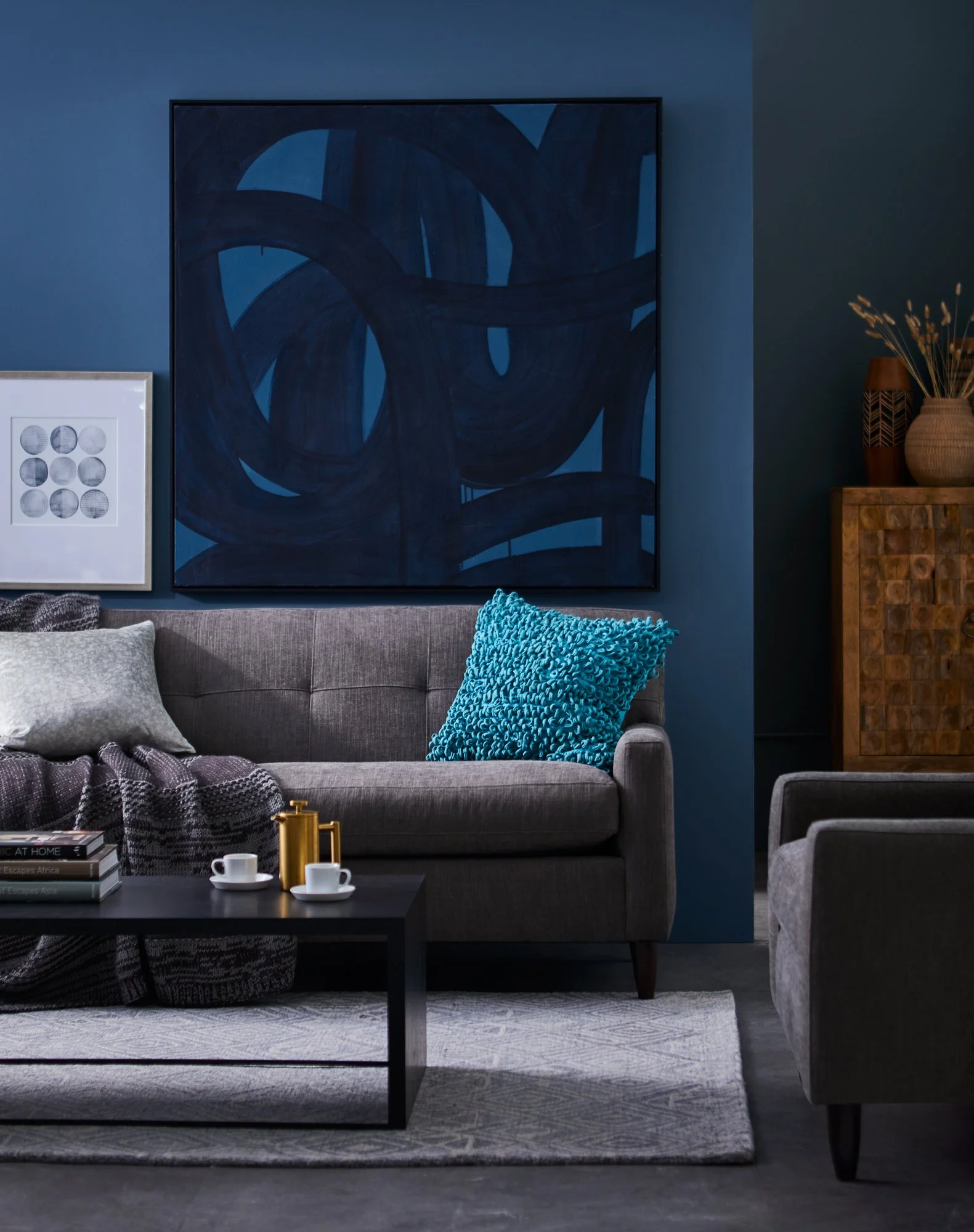 Adam Krauth Photo - Commercial Photography - Boston, MA - Still life - Interior photography. A scene of a bold and modern living room with vibrant blue walls. HomeGoods