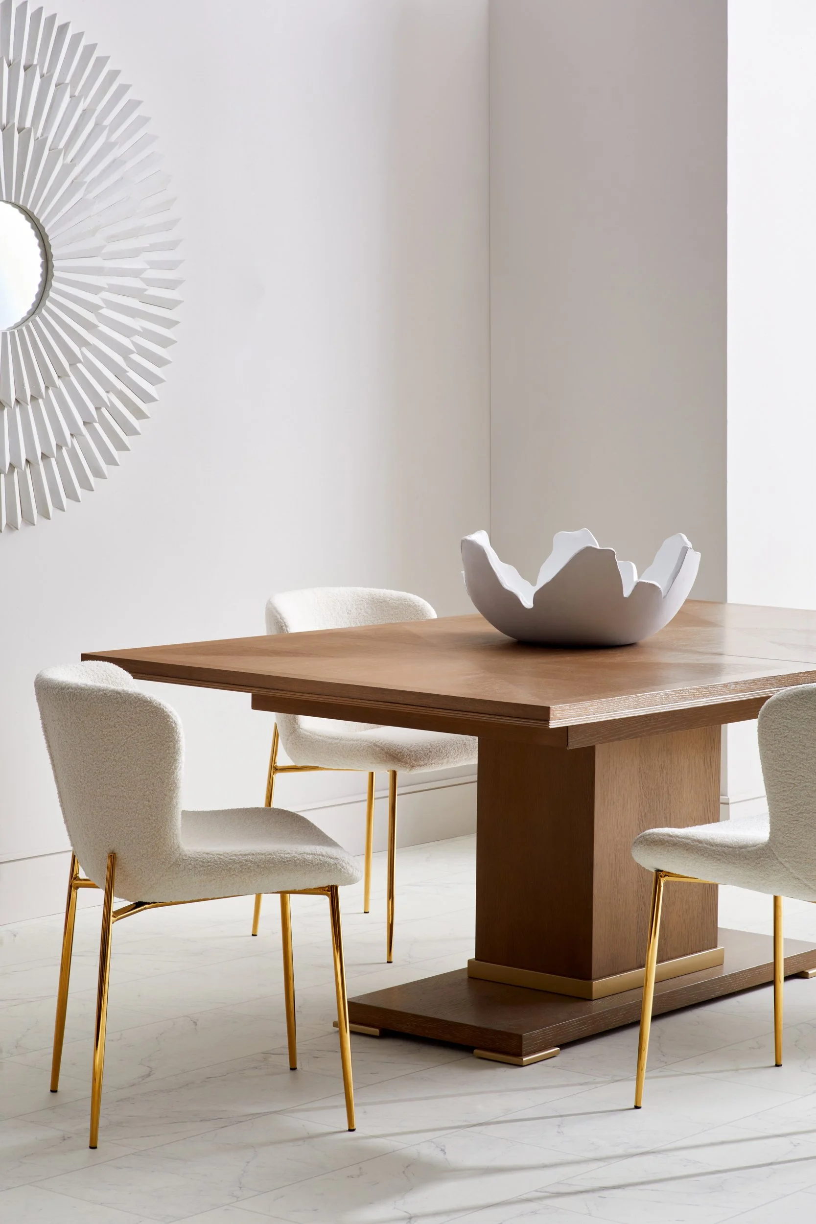 Adam Krauth Photo - Commercial Photography - Boston, MA - Still life - Interior photography. A scene with a modern dining room with a wooden table, four white chairs with gold legs. 