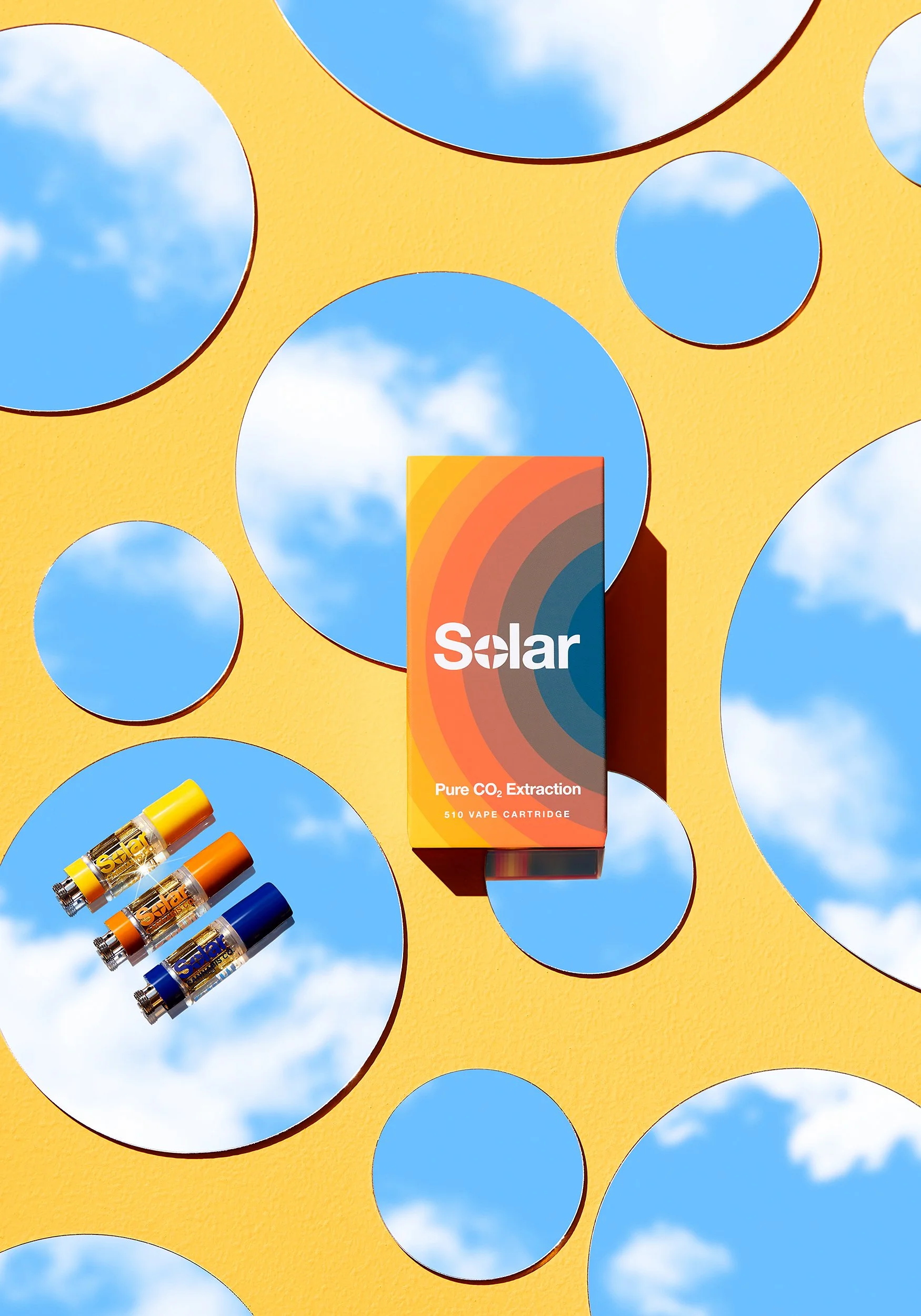 Adam Krauth Photo - Commercial Photography - Boston, MA - Still Life - Product Photography - Solar vape cartridges, on a cloudy mirror background with bright yellow color. 