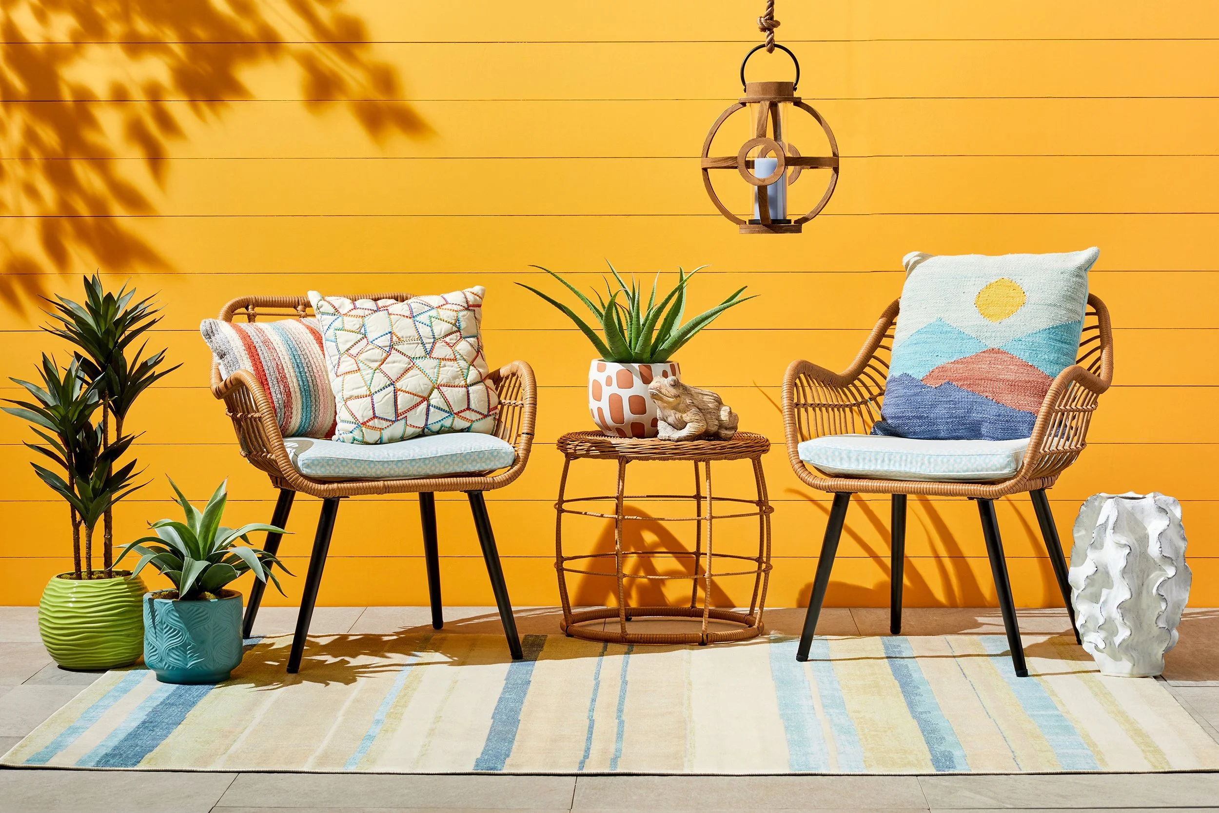 Adam Krauth Photo - Commercial Photography - Boston, MA - Still life - Interior photography. A scene with a yellow outdoor wall and rattan chairs. 