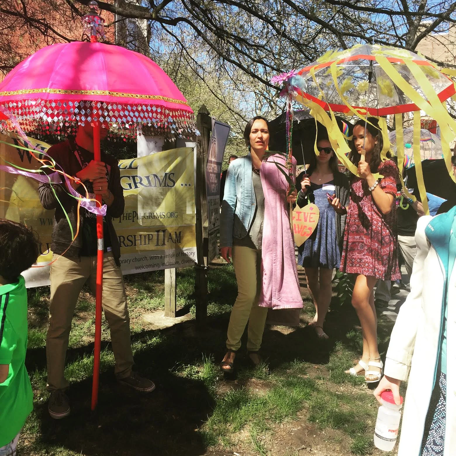 Pilgrim Diana Bruce carries one of our "cloaks" during our Palm Sunday procession. 