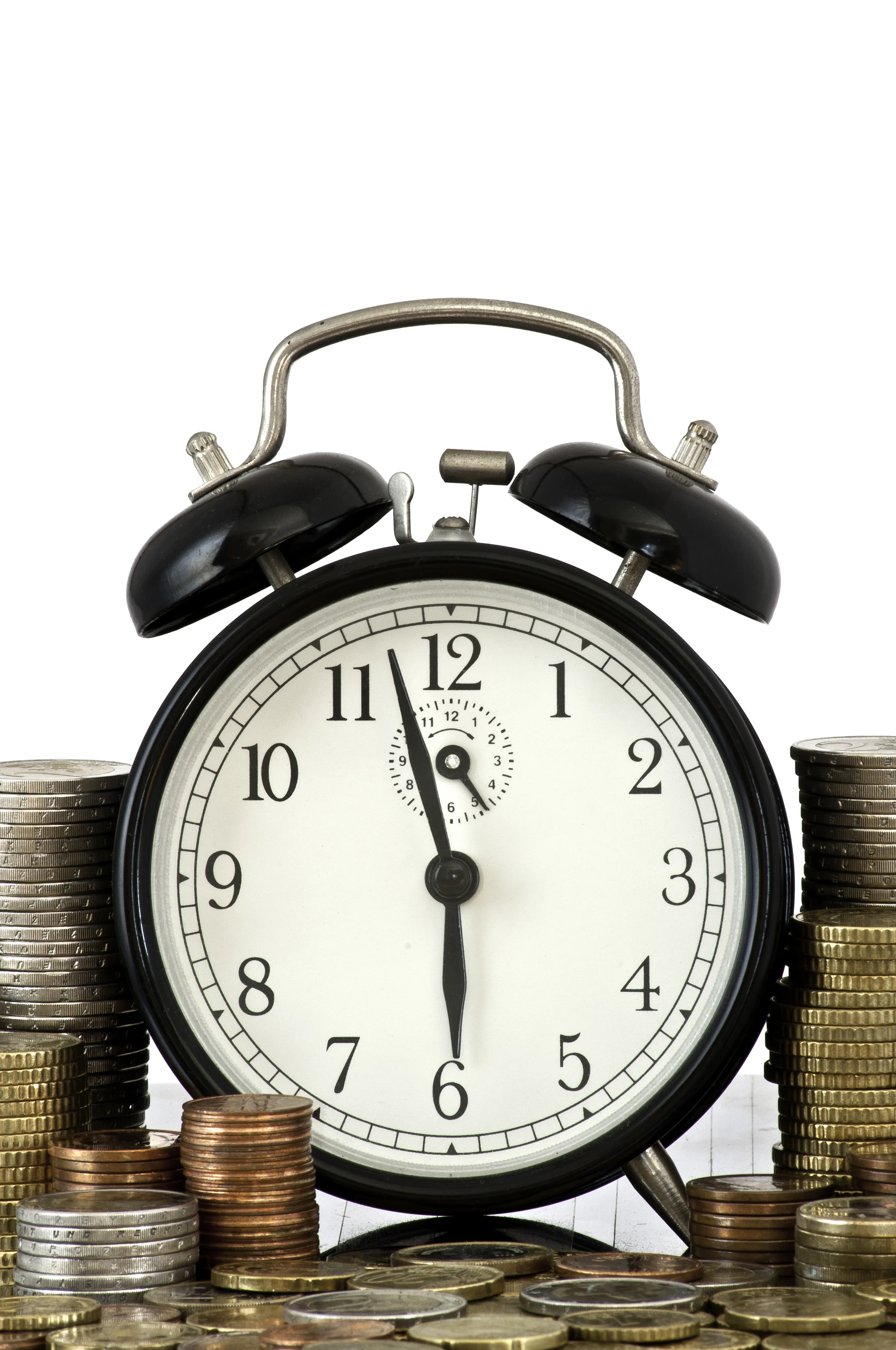 TIME IS MONEY concept: alarm clock and lots of euro coins